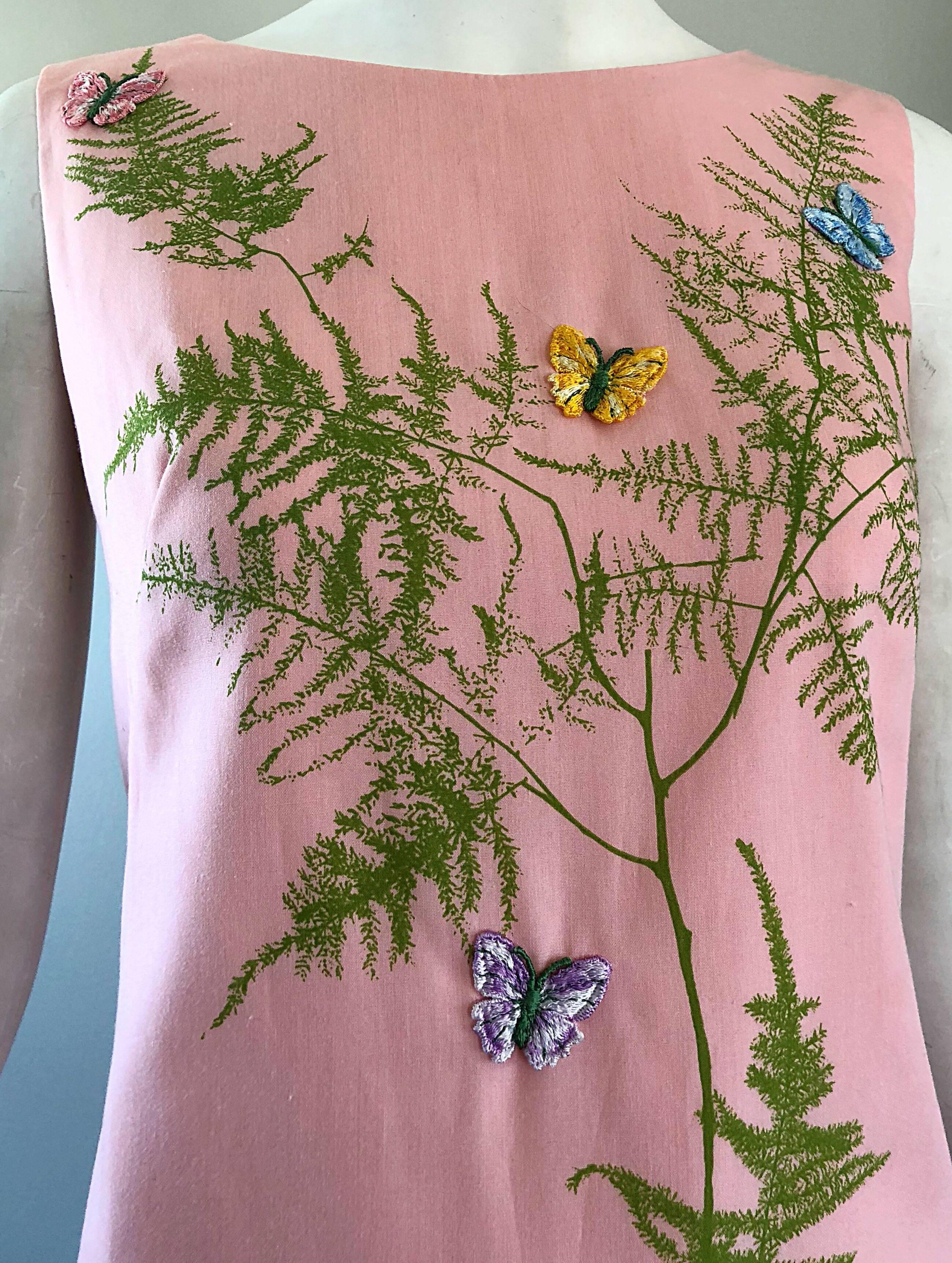 Chic 60s light pale pink cotton novelty shift dress! Features printed trees in olive green throughout. Embroidered butterflies in purple, blue, yellow and pink hand-sewn throughout. Perfect shift style is easy and flattering to wear. Full metal