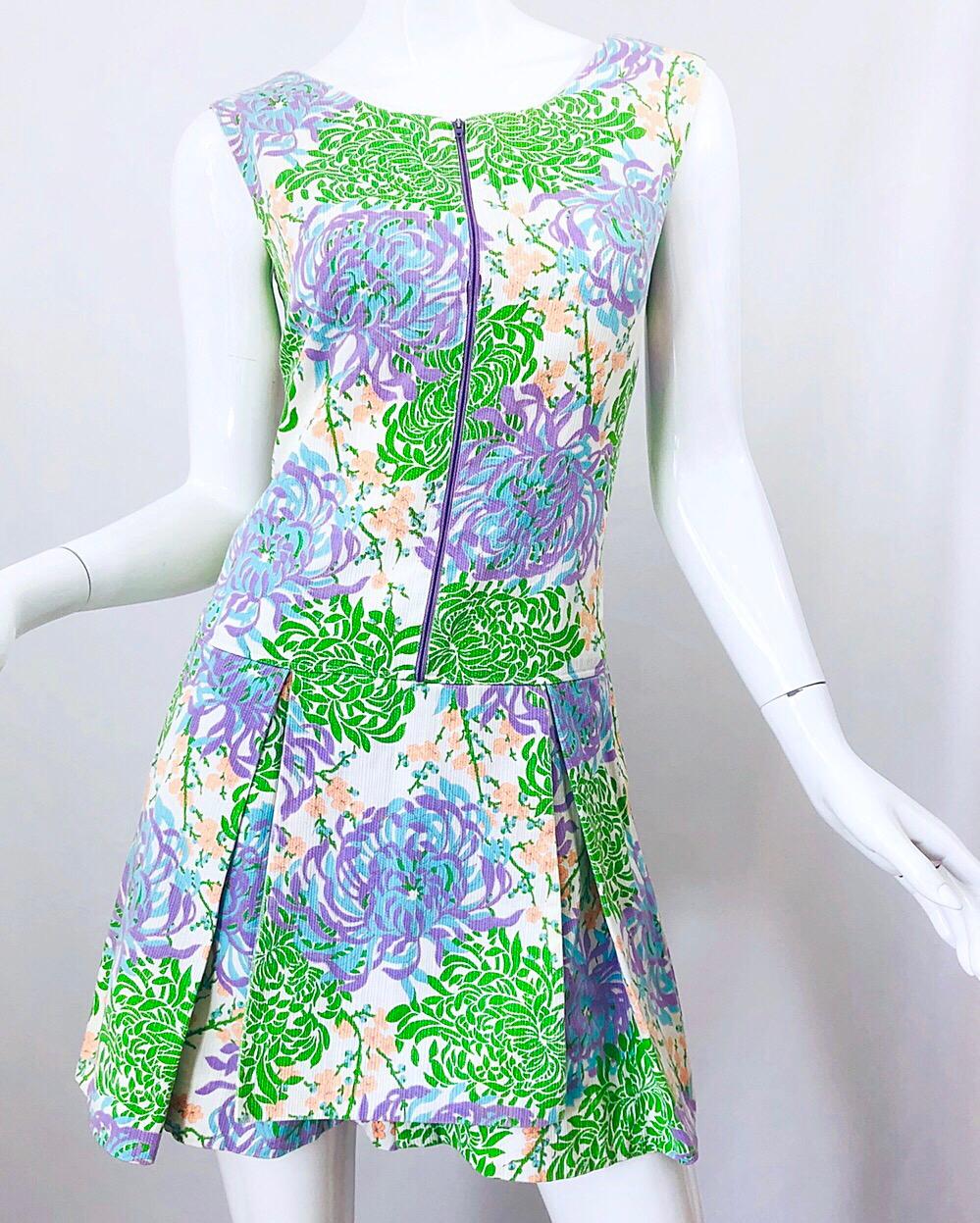 Chic 1960s pastel purple, blue, pink, green and white cotton blend sleeveless one piece romper! The construction on this shorts jumpsuit is unlike any I have ever seen. Hidden zippers under the crotch makes these easy to take on and off. Purple