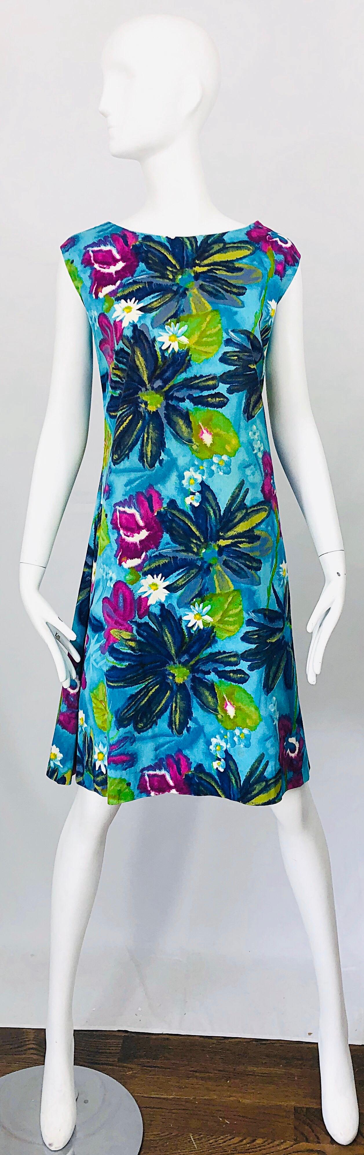 Chic 1960s Large size brightly colored mod flower print cotton A Line dress! Features v I rant colors of blue, turquoise, fuchsia pink, neon lime green, purple, navy blue, orange and white throughout. Fuchsia cotton panels at each side of the skirt