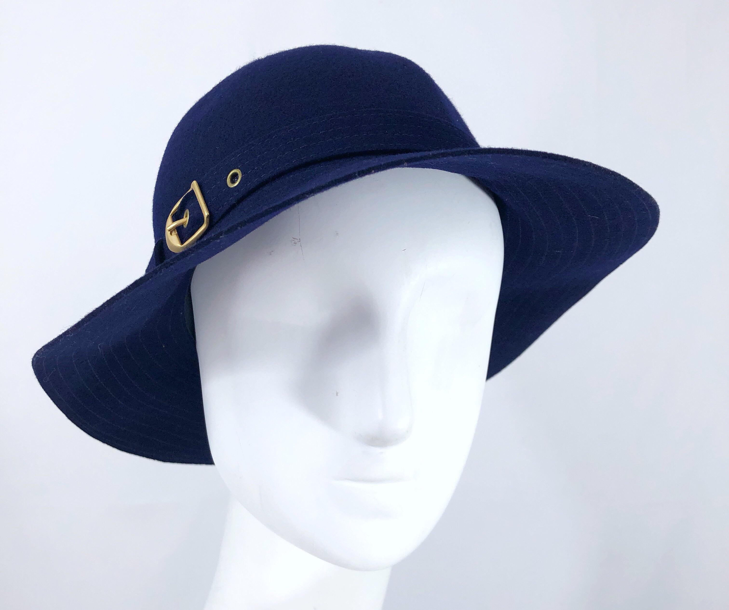 Chic 1970s HALSTON navy blue wool hat! Soft navy blue wool with a gold buckle on the side. The perfect stylish addition to any outfit. In great condition. Made in USA
Will fit an arrray of sizes because of stretch
Measurements:
9 inches from
