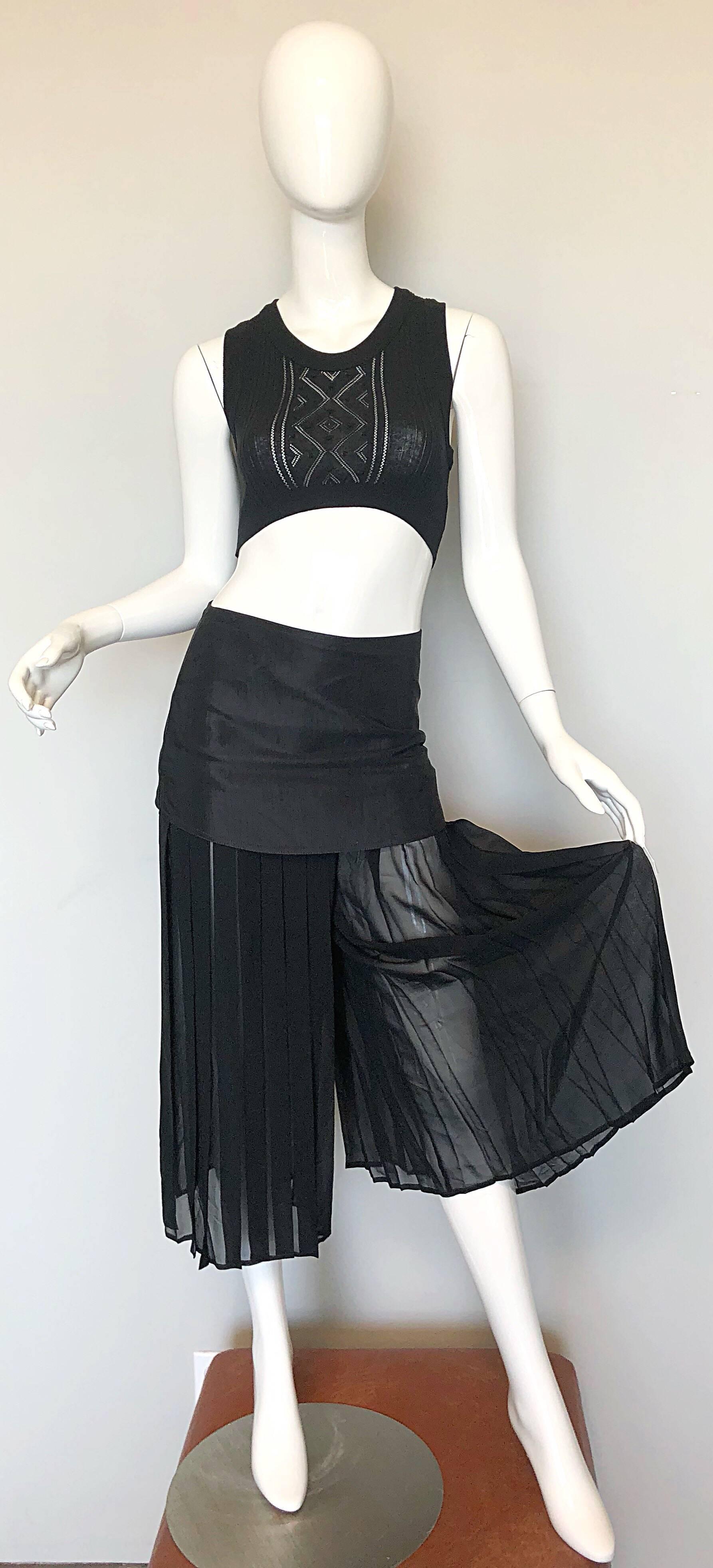 Chic 90s Italian made black vintage silk chiffon wide leg cropped culottes with attached mini skirt! Features semi sheer accordian pleated chiffon pants with an attached mini skirt. Hidden zipper up the side with hook-and-eye closure. Extremely well