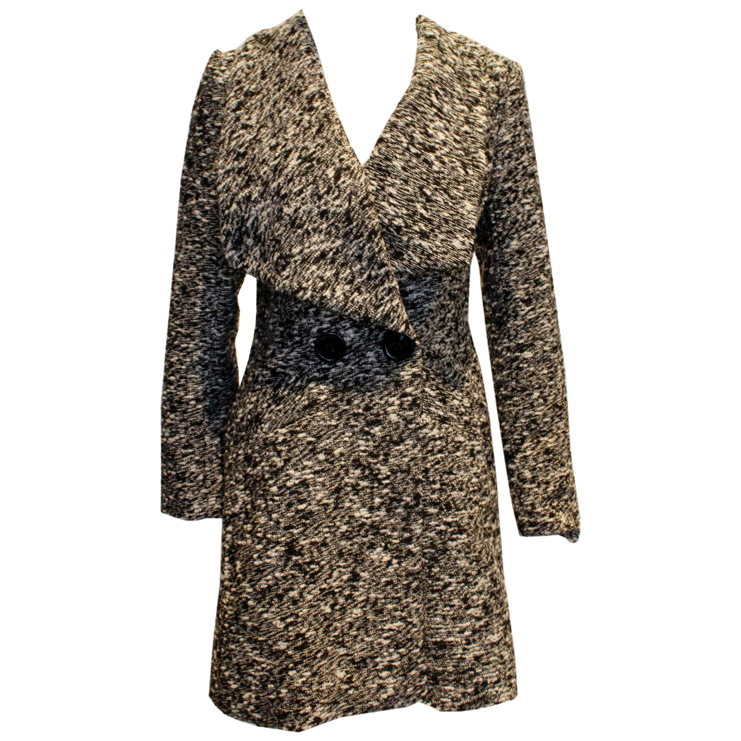 Cappotto chic e contemporaneo in bianco e nero