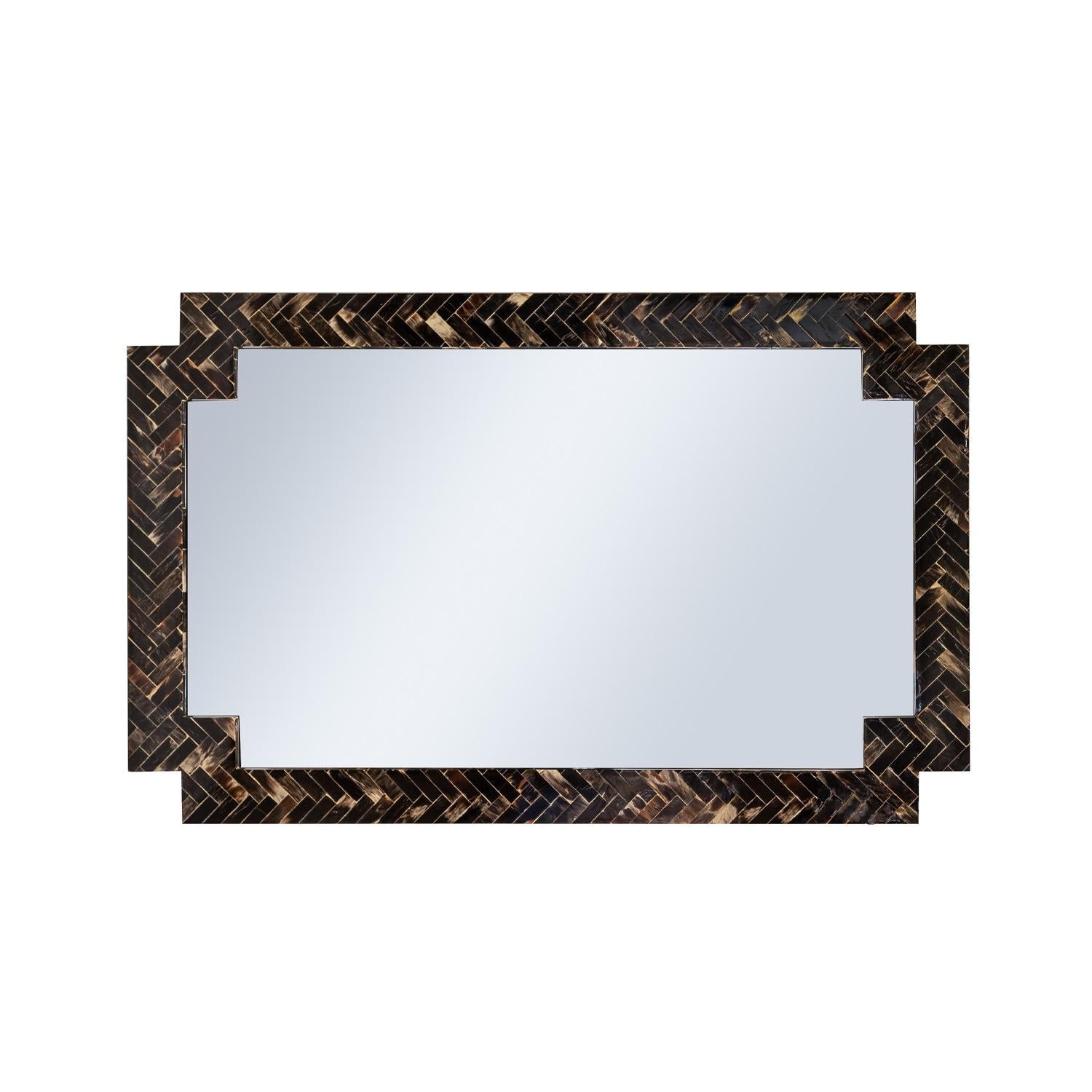 Beautifully made mirror in tessellated Horn in a chevron pattern with indented corners, custom design, American 1970s. This mirror can hang horizontally or vertically and is very chic.