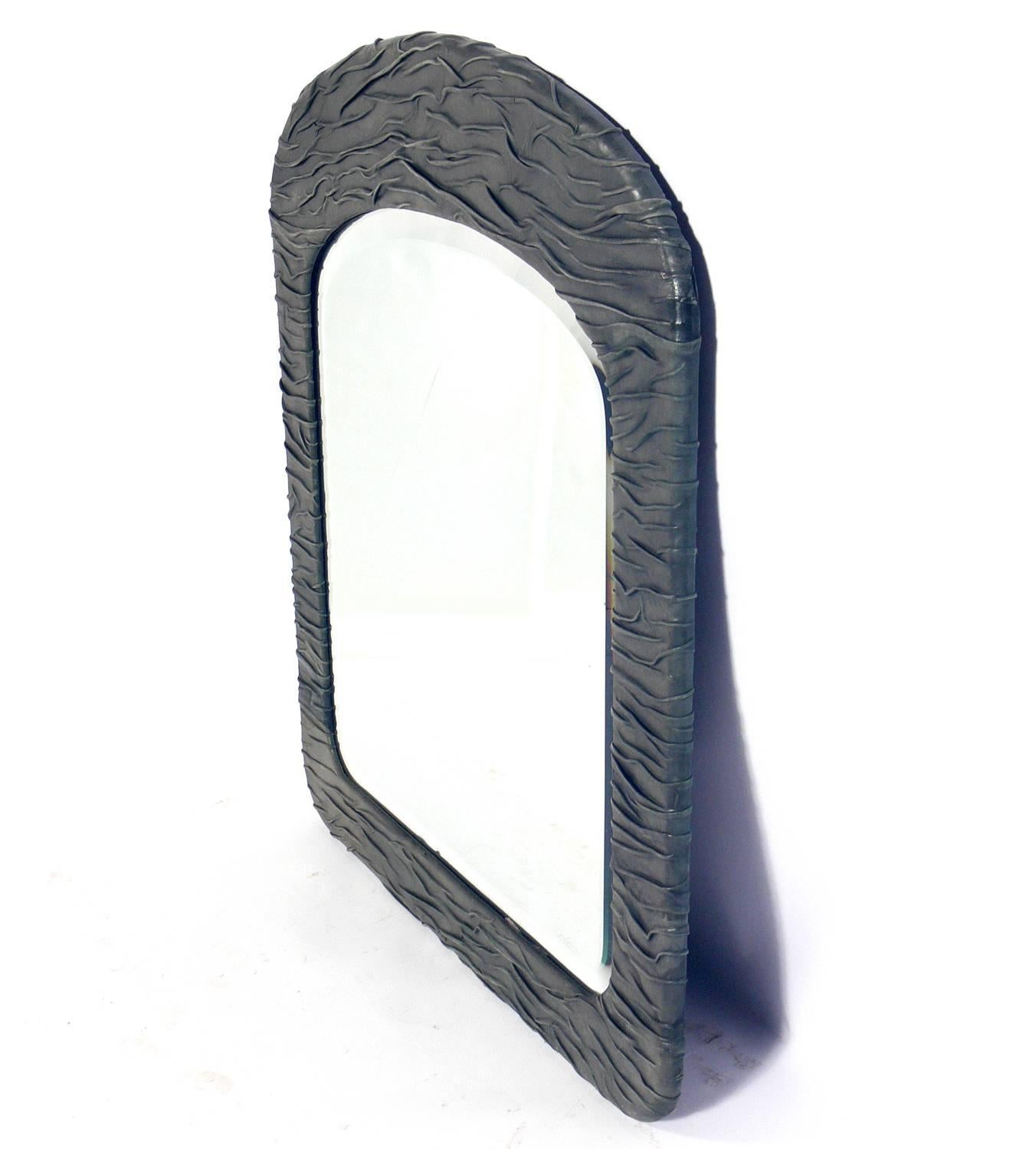 Chic artist made leather mirror, American, circa 1980s. Handmade and signed by the artist, Jane Adams. This piece is executed in a greenish gray color leather.