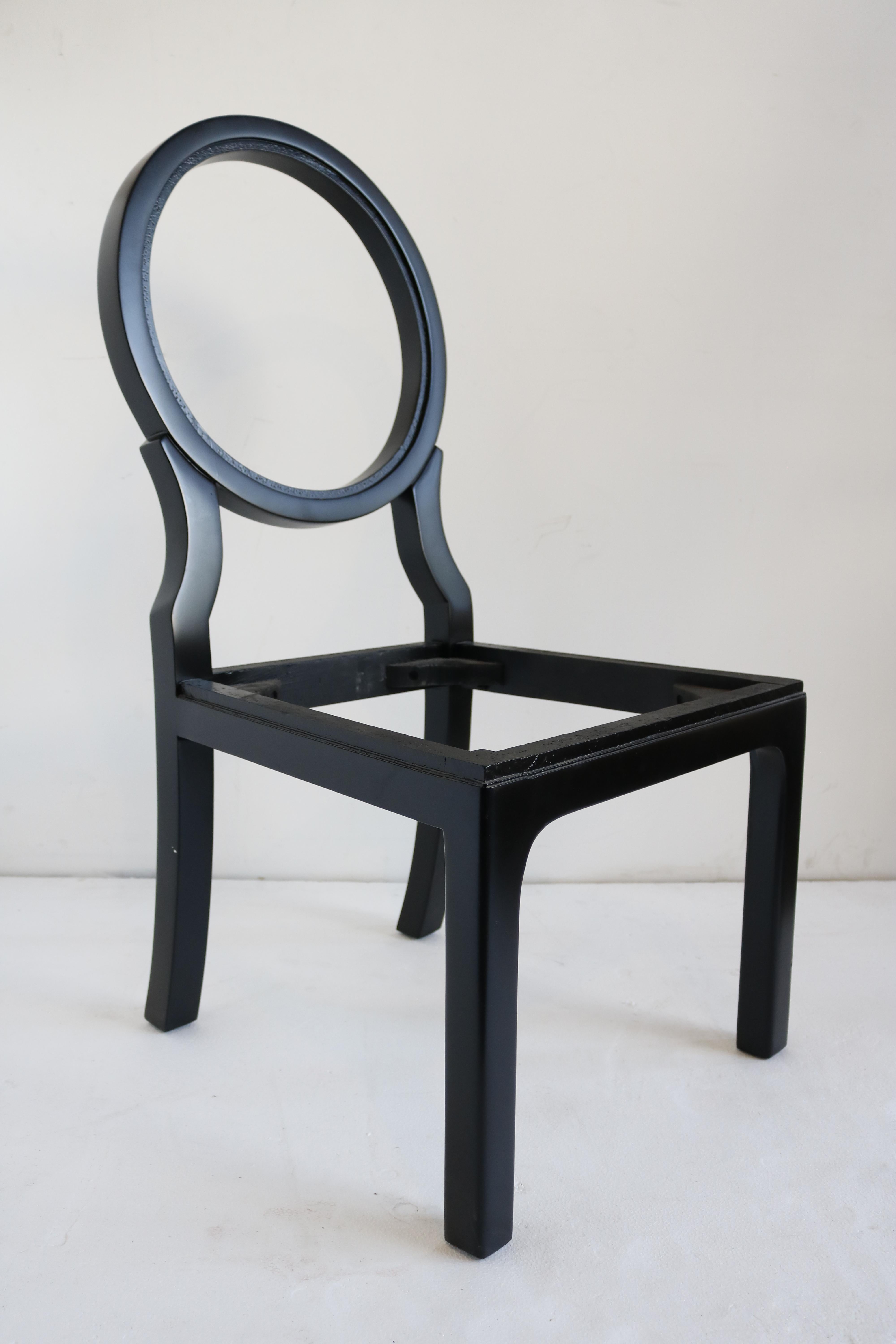 Set of eight dramatic round-backed dining chairs.
These chairs are a beautiful statement piece. They have been re-lacquered in black lacquer.
Only one of them has been reupholstered. (see picture)
The price indicated is before re-upholstery.
