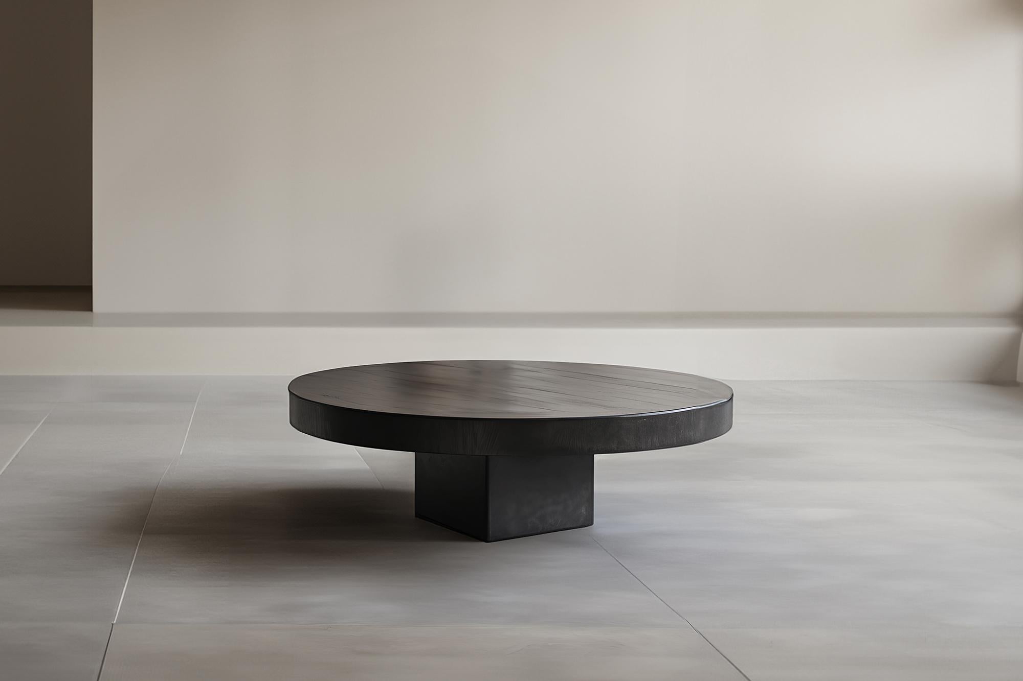 Chic Black Tinted Round Coffee Table - Urban Fundamenta 27 by NONO

Sculptural coffee table made of solid wood with a natural water-based or black tinted finish. Due to the nature of the production process, each piece may vary in grain, texture,