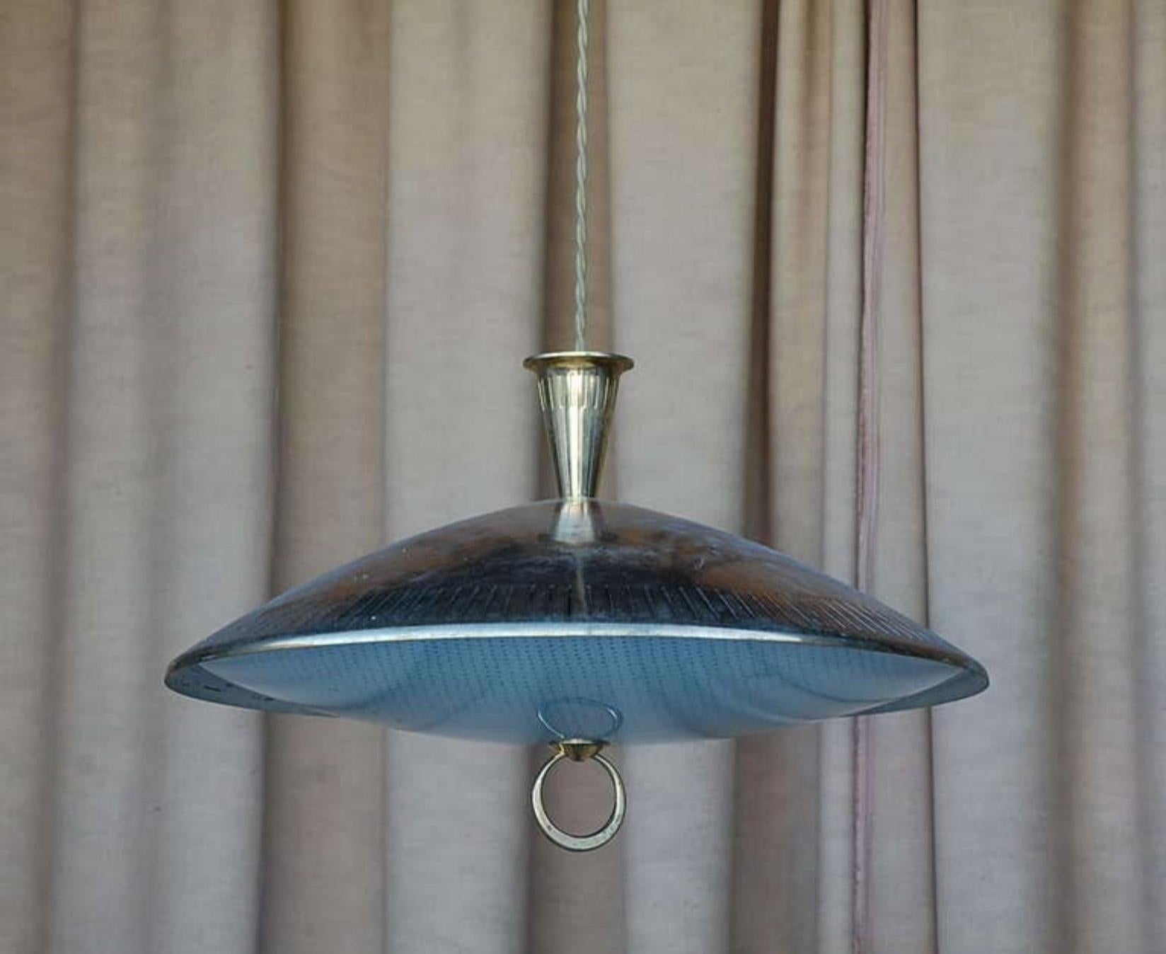 Chic brass and textured glass pendant light. Matching canopy. Extra long cord to adjust drop.