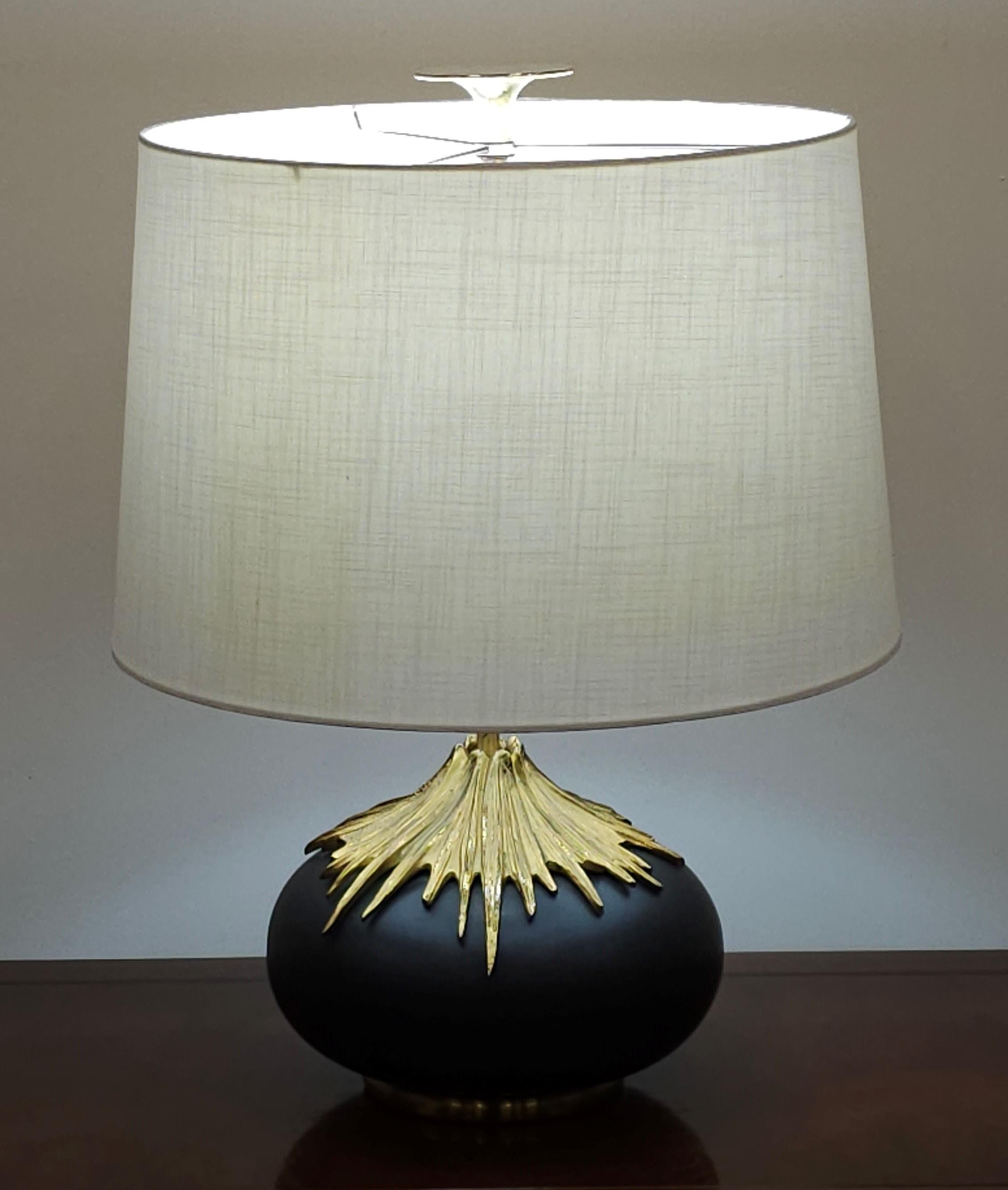 A chic bronze and brass table lamp by Maison Charles stamped 