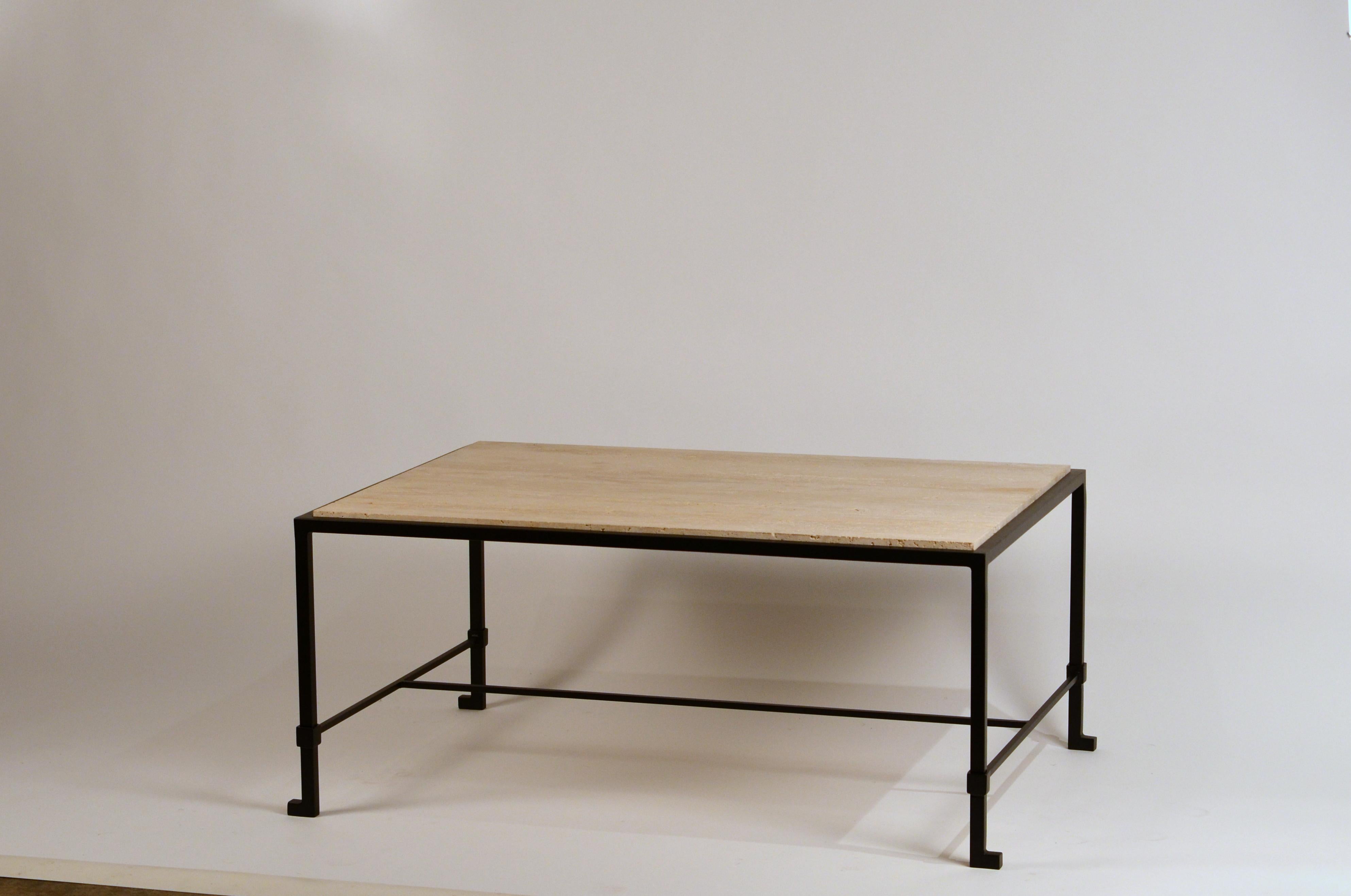 Chic blackened wrought iron and polished raw travertine French 1940s style coffee table. Inspired by the designs of Marc du Plantier and Paul Dupré-Lafon. Great proportions but custom sizes available as well.