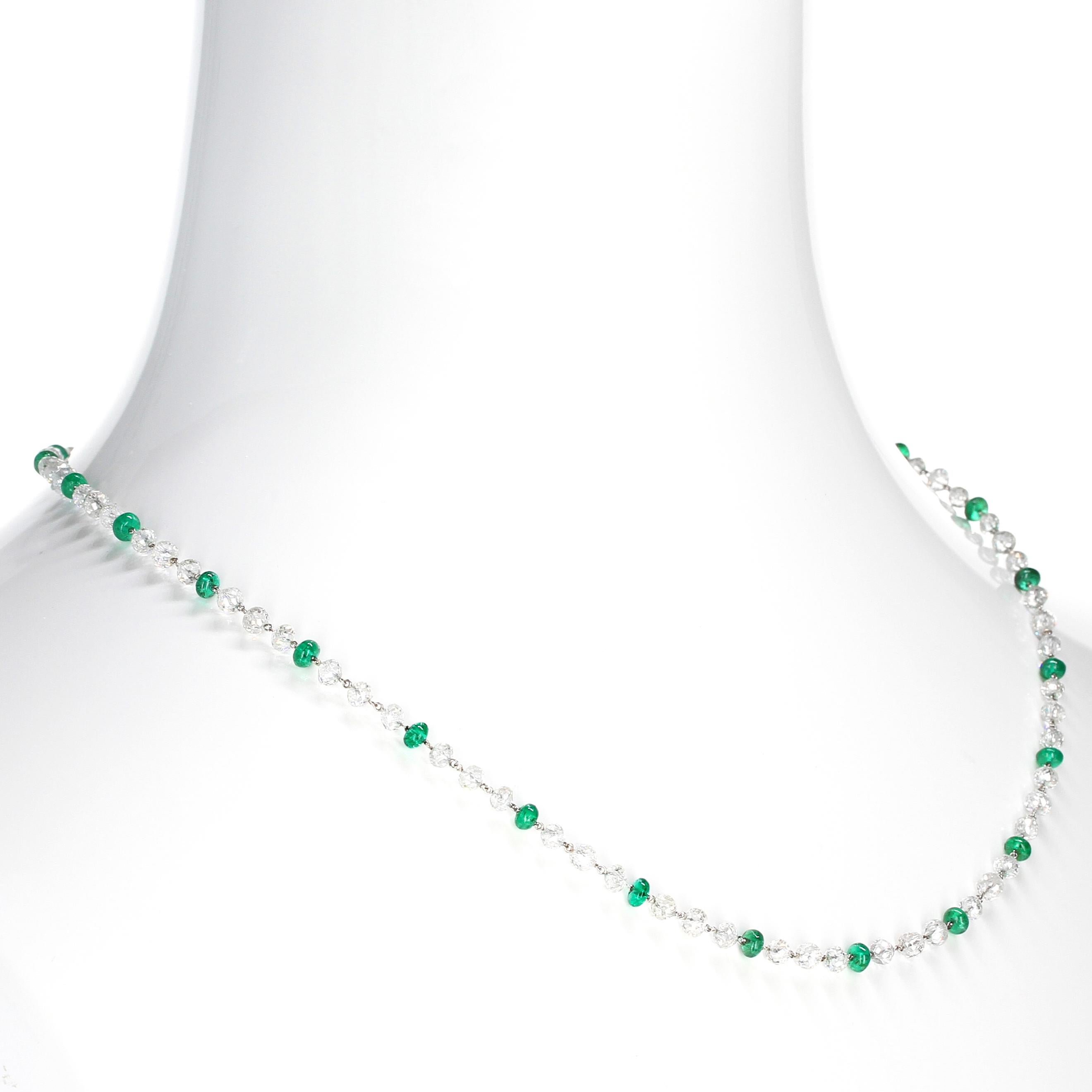 An elegant and chic diamond and emerald bead link necklace, hand-made in Platinum, with an estimated color-clarity of the diamonds as E/F-color, with VS-clarity weighing a total of approximately twenty-five carats. The necklace measures 18 inches,
