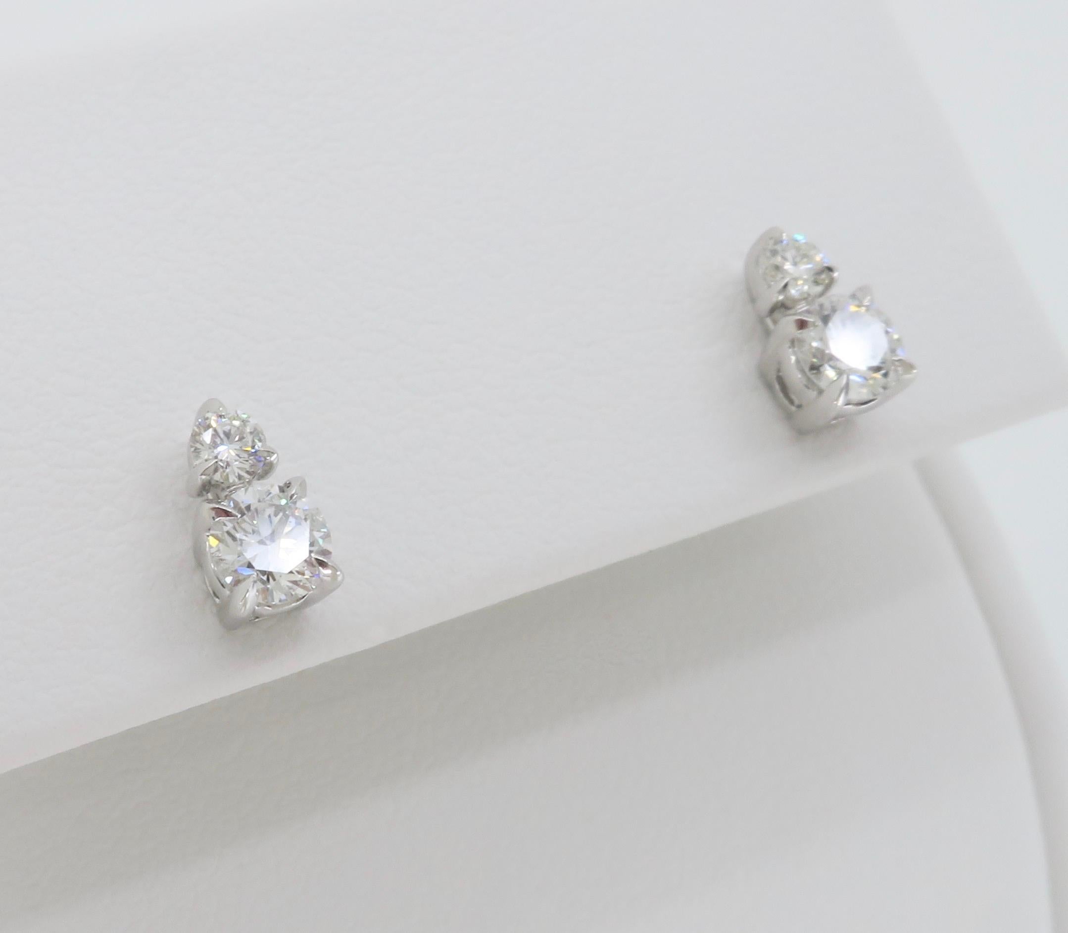 Chic pair of double diamond stud earrings made in 14k white gold that can be worn two ways. 

Diamond Cut: Round Brilliant
Average Diamond Color: E-F
Average Diamond Clarity:  VS
Diamond Carat Weight: .50CTW 
Metal: 14K White Gold
Marked/Tested: