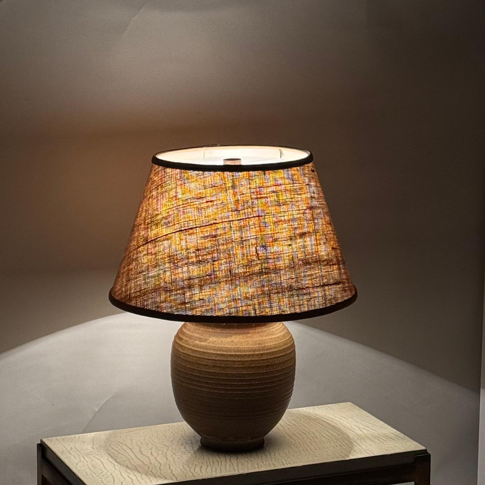 Beautifully glazed ceramic lamp with custom dark linen shade.
Signed under the base.
Gorgeous during the day and at night.
Chic and understated.
Dimensions listed are the overall dimensions of the lamp with the shade.
The ceramic base alone is 9 in.