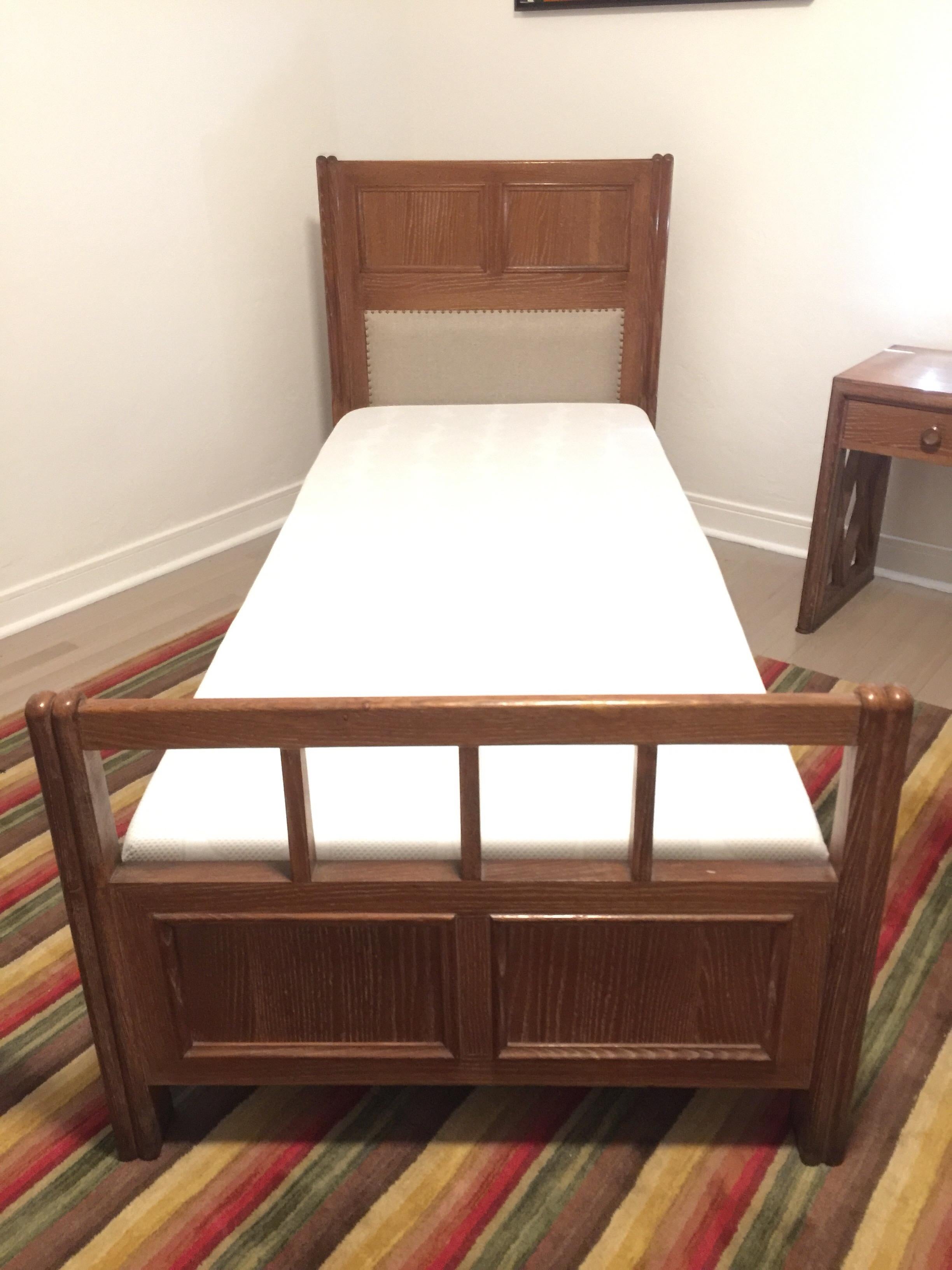 This is a set of Twin beds, frame, base and mattress (included if requested) in a cerused oak. Excellent stability and details throughout. Nail head trim on linen head boards. Perfect for a guest room or for that sophisticated children's room.