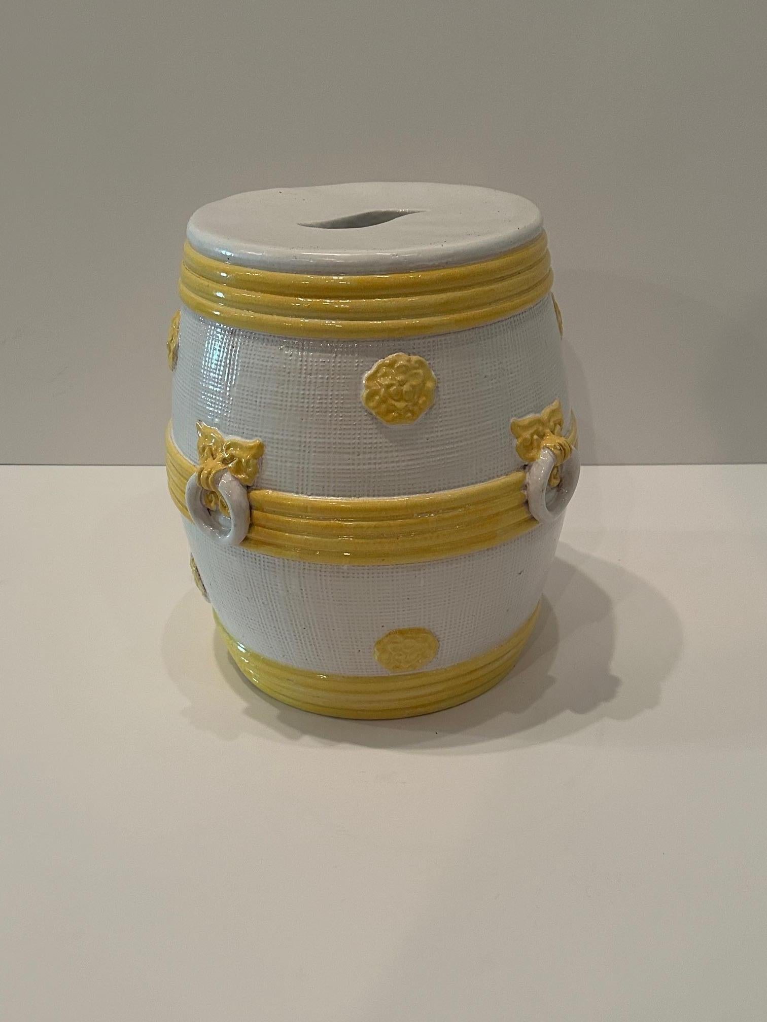 Sunny white and yellow glazed ceramic round garden seat having sophisticated design with faux ring handles.  Makes a superb drinks table indoors or on the patio.