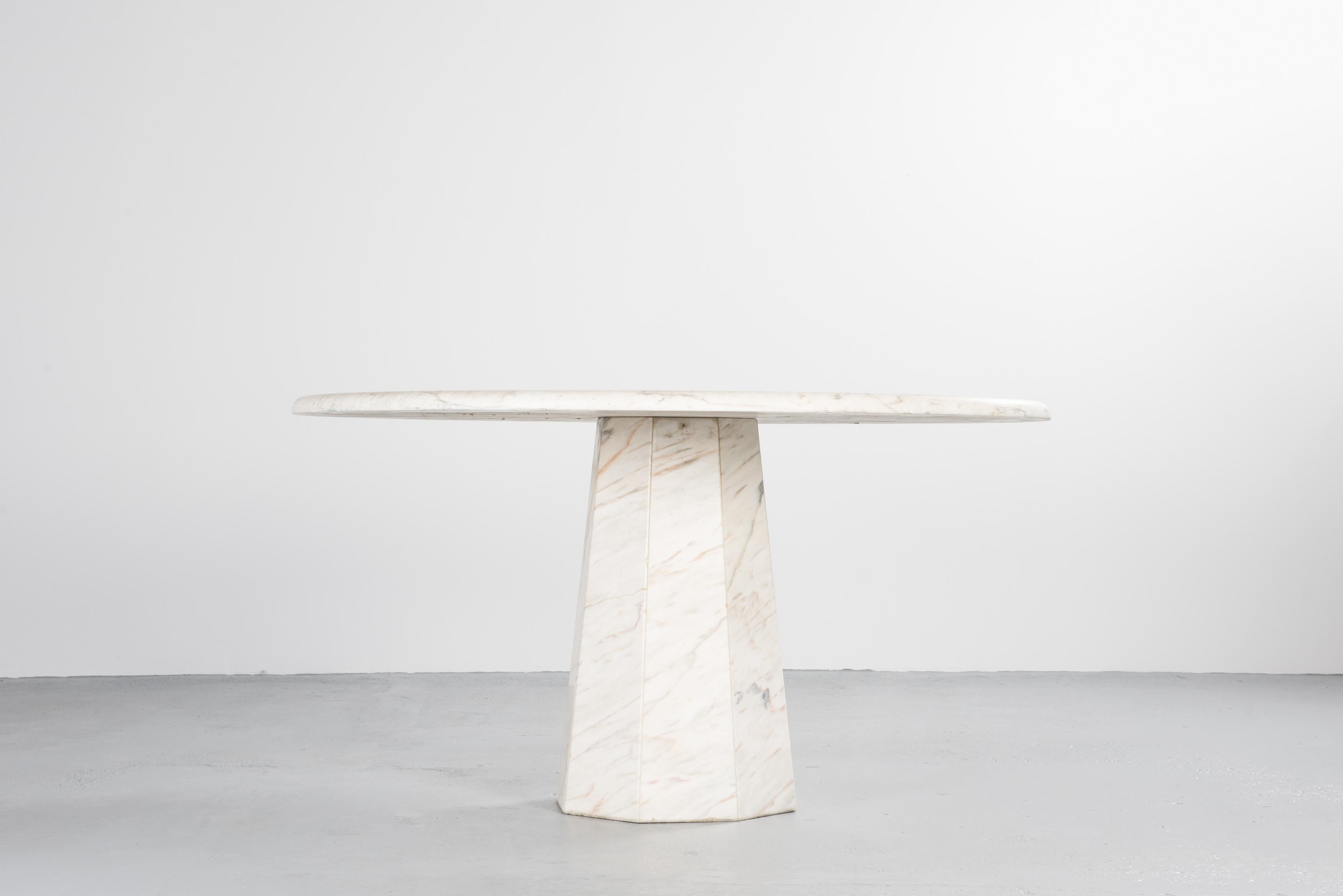 Chic Italian marble dining table

Round table with an octagonal base, all in white Italian marble.
Chic and yet minimalistic, traditional technique yet with a timeless look, this elegant dining table combines the unobtrusiveness of design and the