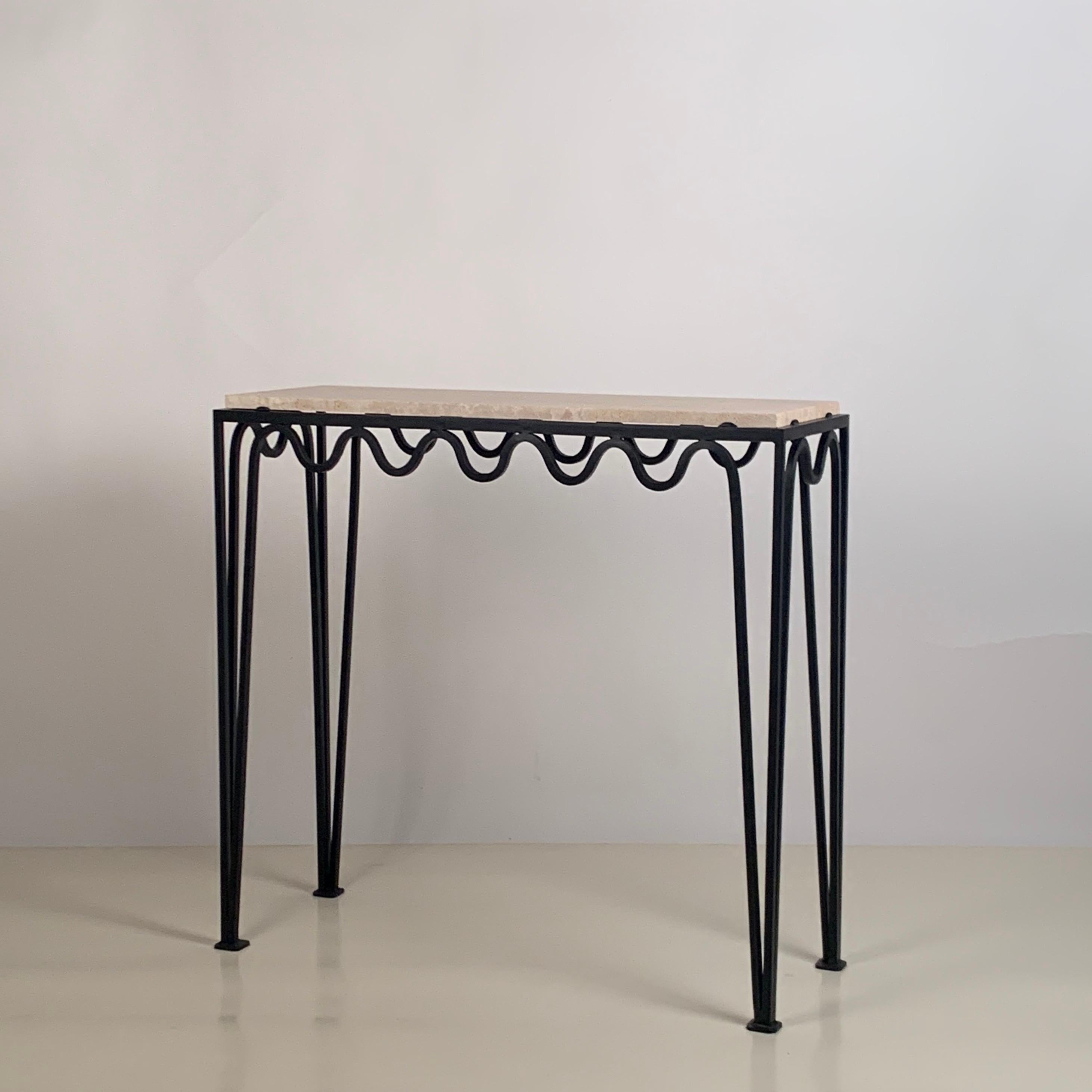 Chic 'Méandre' travertine console by Design Frères.

Blackened steel base fitted with an Italian travertine top.

Inspired by the timeless aesthetic of French modern design, this console from our exclusive Design Frères line is handmade in our