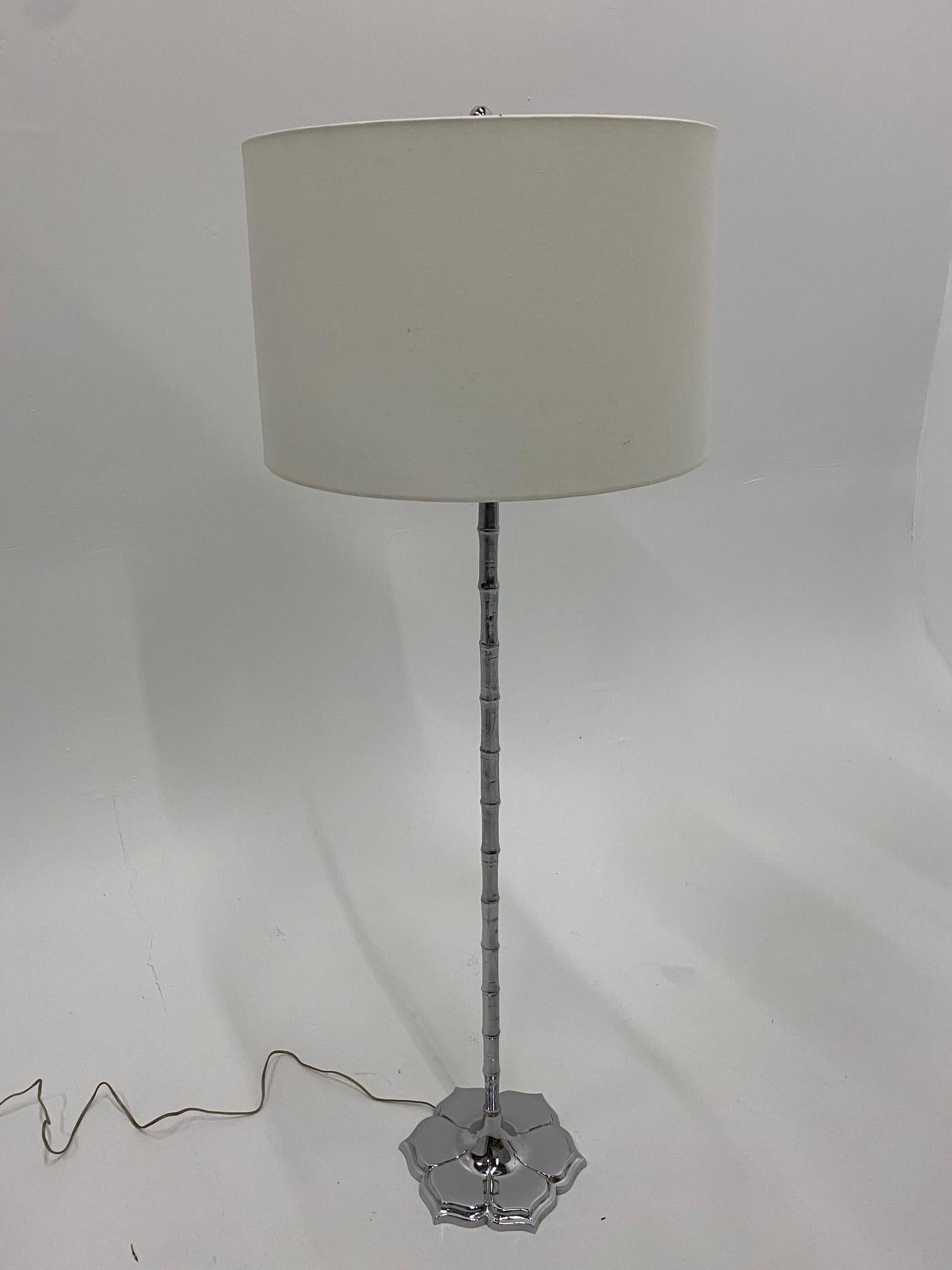 Elegant Mid-Century Modern chrome floor lamp with faux bamboo column and pretty lotus flower shaped base.
Shade not included.