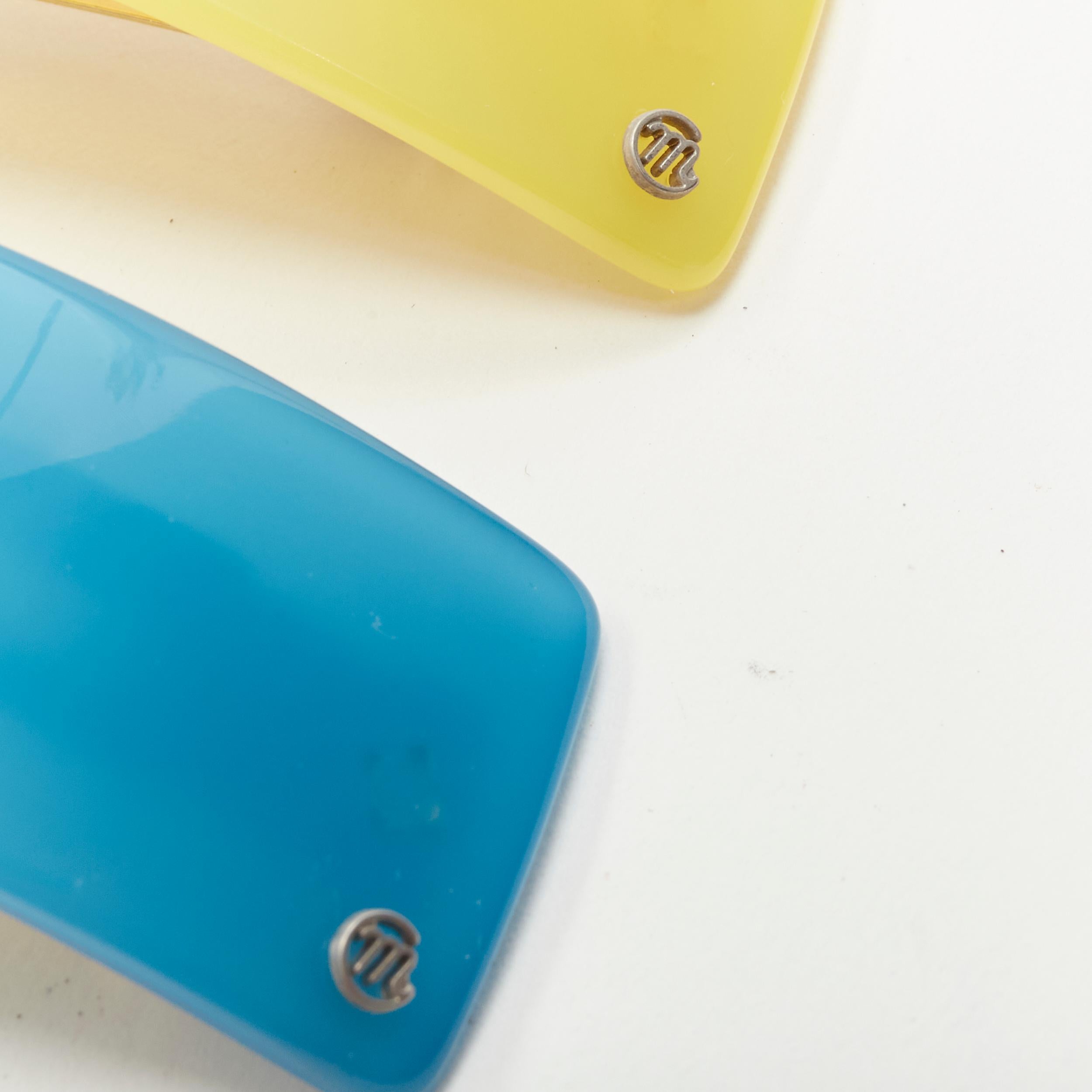 CHIC & MODE Alexandre Zouari color block shiny surface logo acrylic clips X3
Reference: ANWU/A00321
Brand: Alexandre Zouari
Designer: Alexandre Zouari
Collection: Chic & Mode
Material: Acrylic, Metal
Color: Yellow, Blue
Pattern: Solid
Closure: Clip