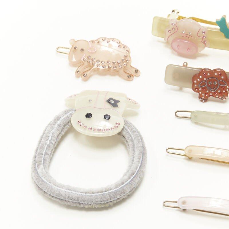 CHIC & MODE Alexandre Zouari LOT OF 9 farm animal crystal acrylic hair clip ties
Reference: ANWU/A00247
Brand: Chic and Mode
Designer: Alexandre Zouari
Material: Plastic, Metal
Color: Other
Pattern: Solid
Extra Details: 2 large clips. 5 small clips.