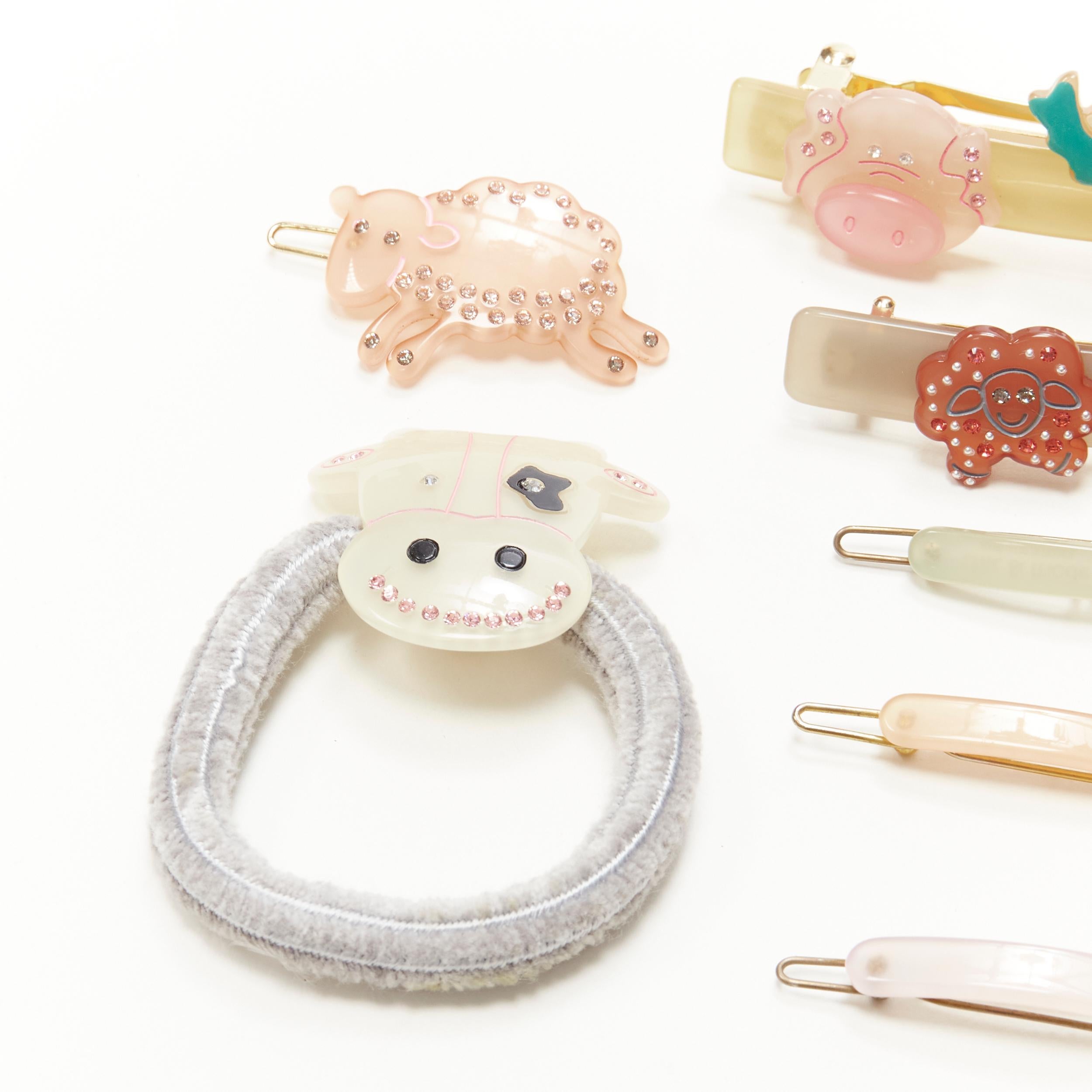 CHIC & MODE Alexandre Zouari LOT OF 9 farm animal crystal acrylic hair clip ties 
Reference: ANWU/A00247 
Brand: Chic and Mode 
Designer: Alexandre Zouari 
Material: Plastic 
Color: Pastel 
Pattern: Solid 
Extra Detail: 2 large clips. 5 small clips.