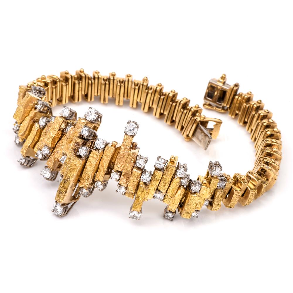 This alluring vintage bracelet of unmatched feminine grace is crafted in 18 karat yellow nugget gold which embellish the borders of the central zig-zagged décor of bracelet. The 42 round-faceted diamonds weigh collectively 2.10 carats and are graded