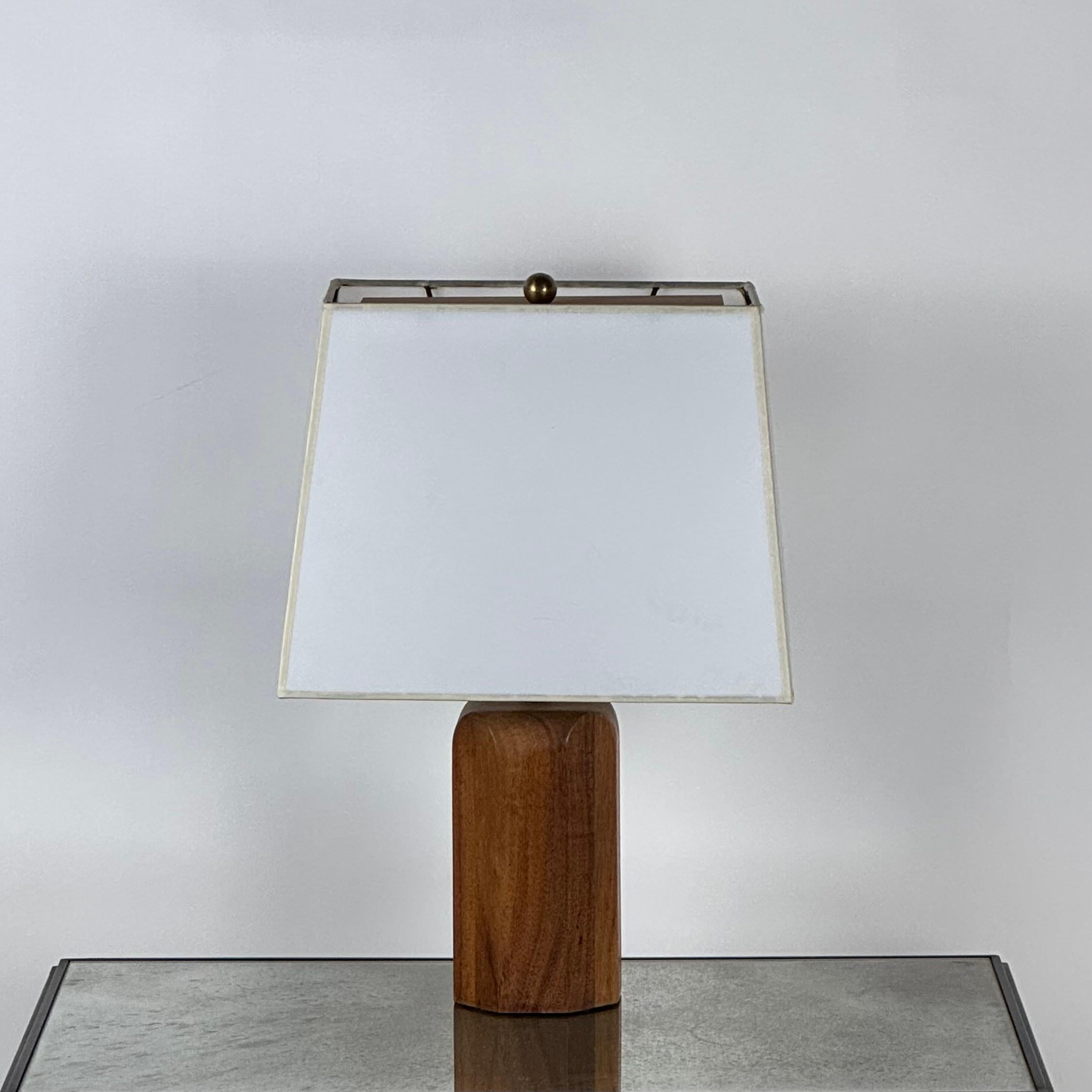 This mid-century desk lamp is the geometry lover's special.
The octagonal walnut base and custom trapezoid shade give this small, simple lamp a terrific presence.
Dimensions listed are the overall dimensions of the lamp with the shade.