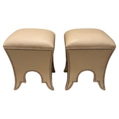 Chic Pair of Faux Leather Cream Ottomans with Storage