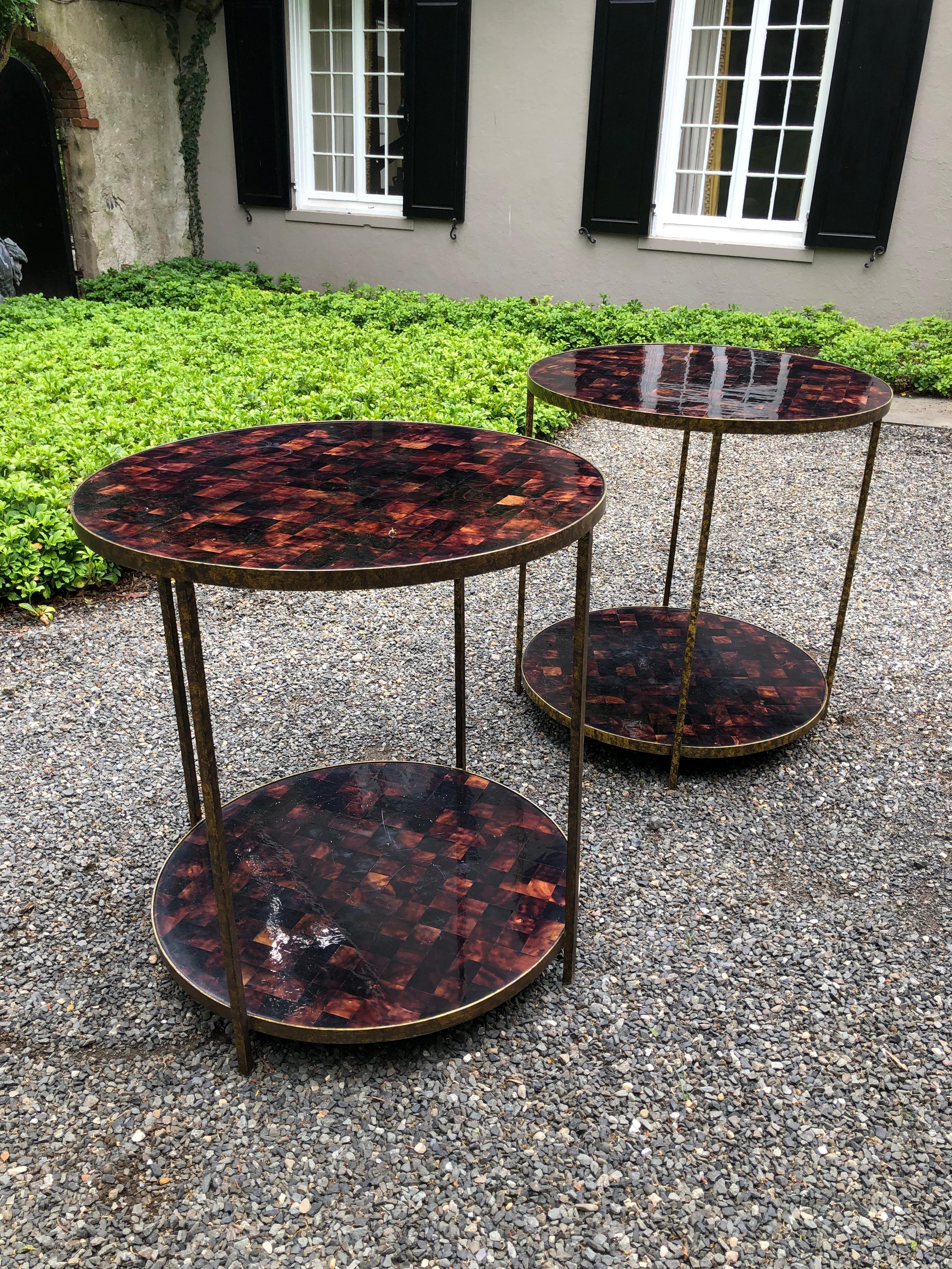 Pair of handsome side tables in faux tortoise shell and gilt metal. The color of the faux tortoise shell is very rich and the gilt of the metal surrounds and legs have great patina. Wonderful to use as either night tables or end tables. These tables