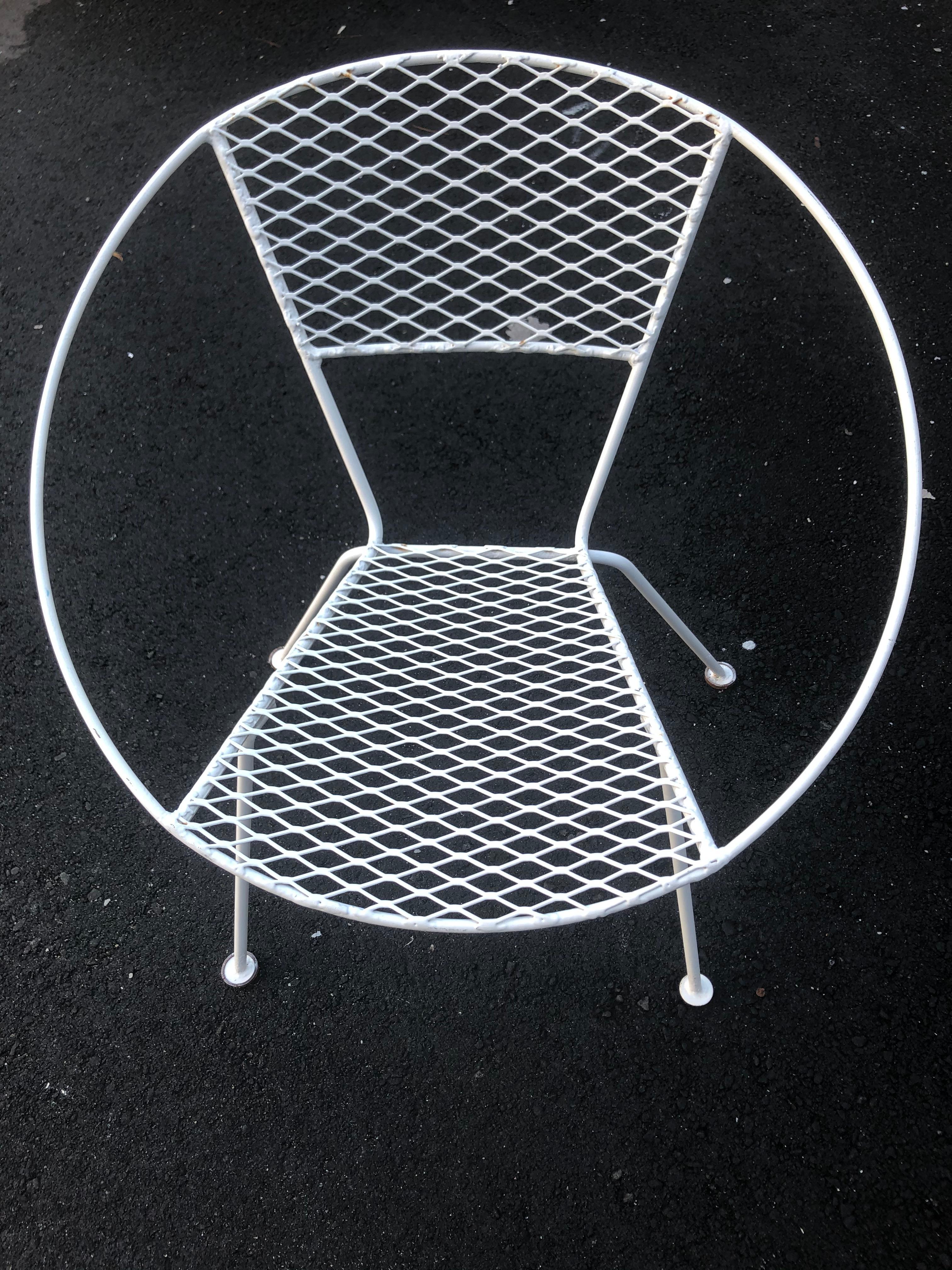 A rare form of Mid-Century Modern chic painted metal patio chairs having an exterior circle with seat suspended inside. Came from a house where there was a huge collection of vintage Knoll furniture, but no markings. Still super cool !