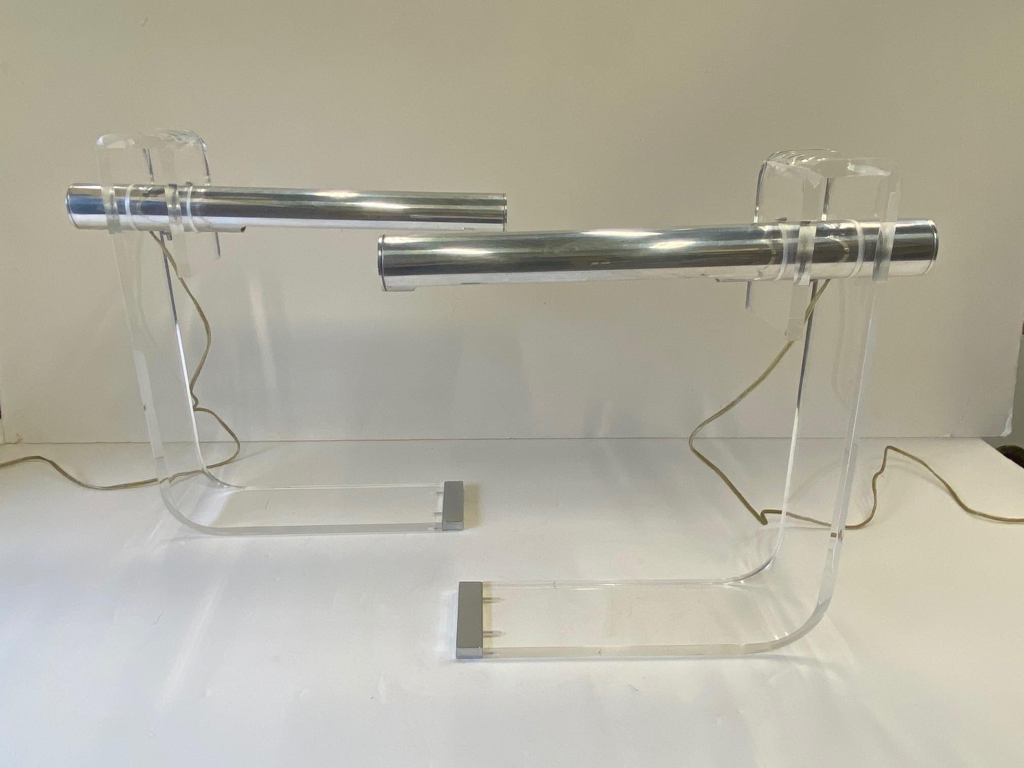 Collectible pair of Sonneman Lucite and chrome desk lamps having streamlined Mid-Century Modern style.