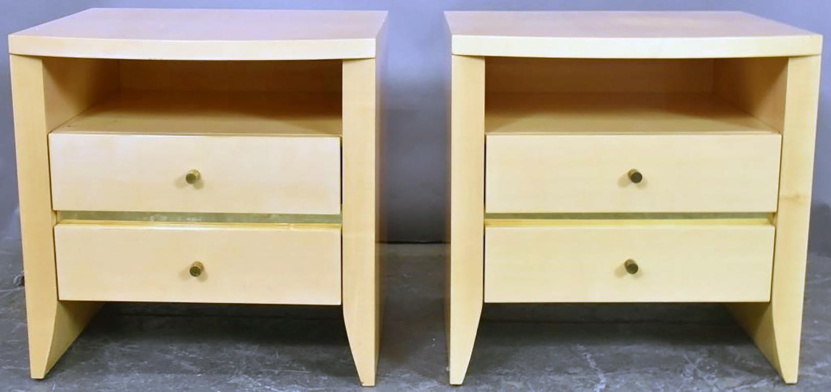 Chic pair of nightstands or end tables with curved tops, a convenient open area above a pair of drawers in a soft yellow lacquer with brass details by J.C. Maley.