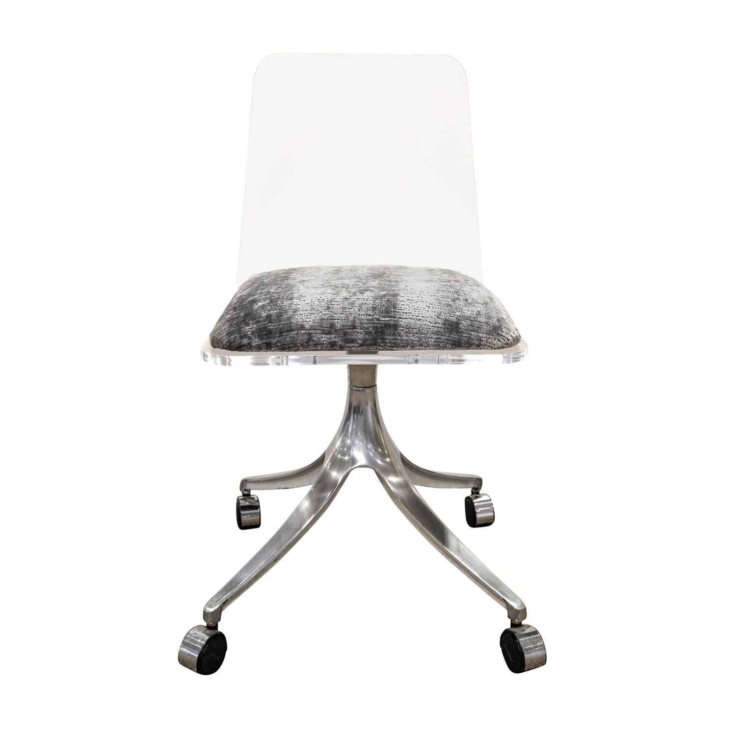 Rolling desk chair with in lucite with newly upholstered seat and sculptural aluminum base, American 1970's.  Seat has been newly upholstered in a beautiful textured gray velvet.  Lucite has been cleaned and polished.  This chair is both comfortable