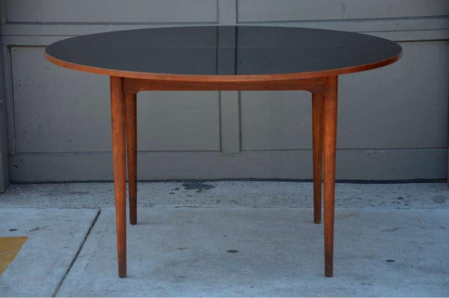 Mid-Century Modern Chic Scandinavian Teak Table with Durable Black Laminate Top For Sale