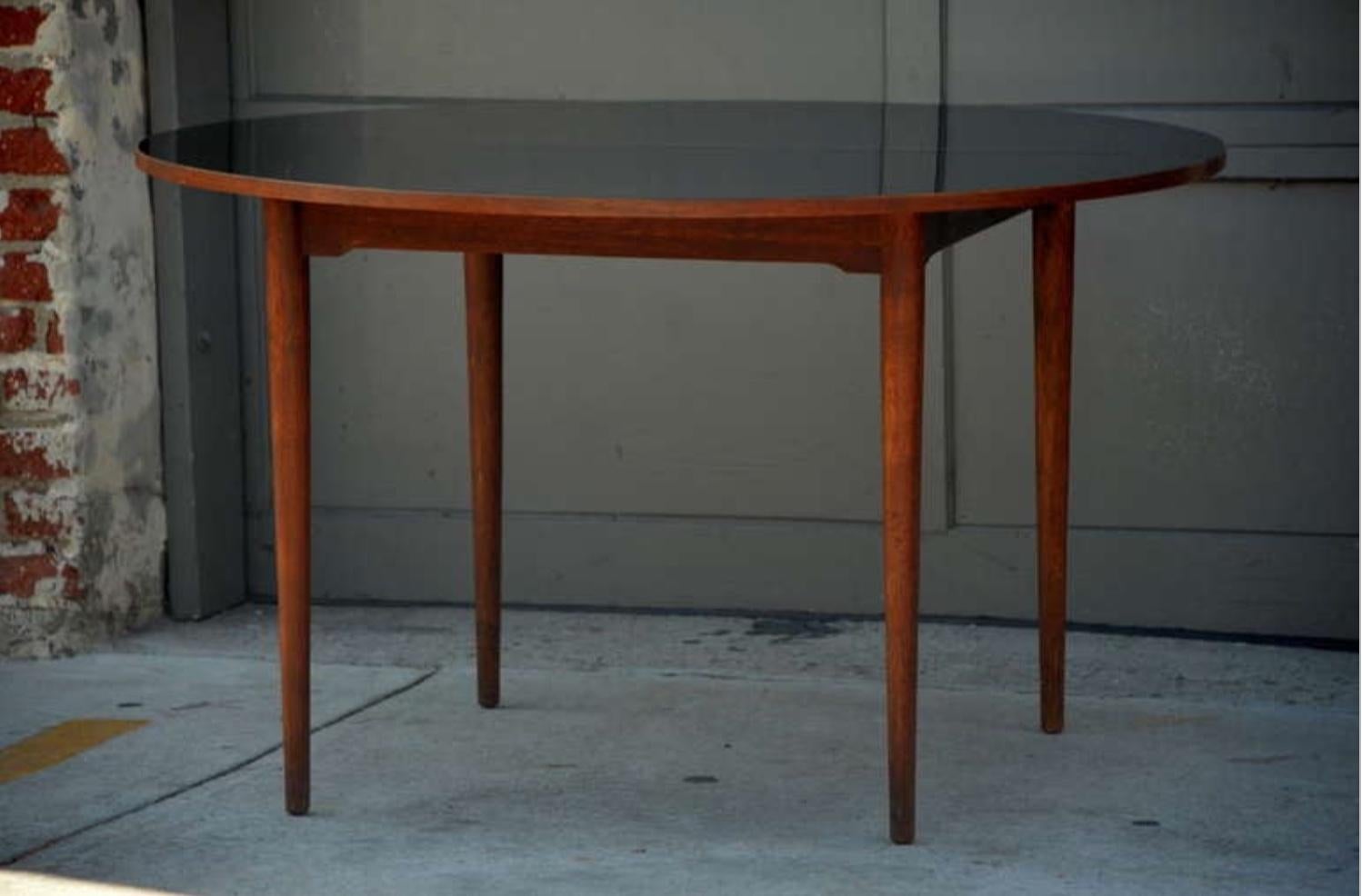 Chic Scandinavian Teak Table with Durable Black Laminate Top In Good Condition For Sale In Los Angeles, CA