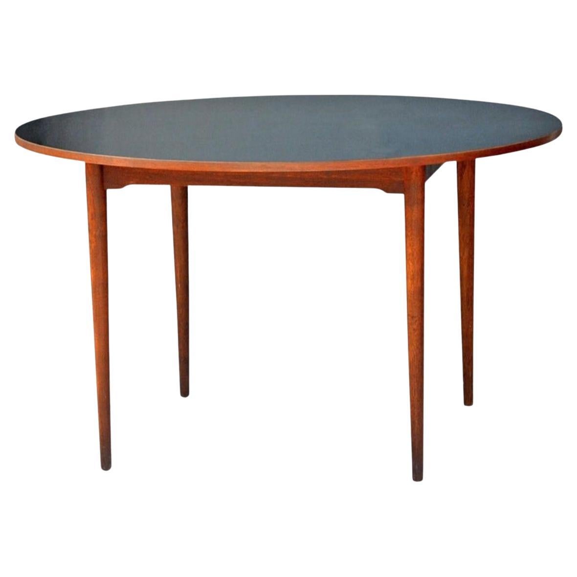 Chic Scandinavian Teak Table with Durable Black Laminate Top For Sale