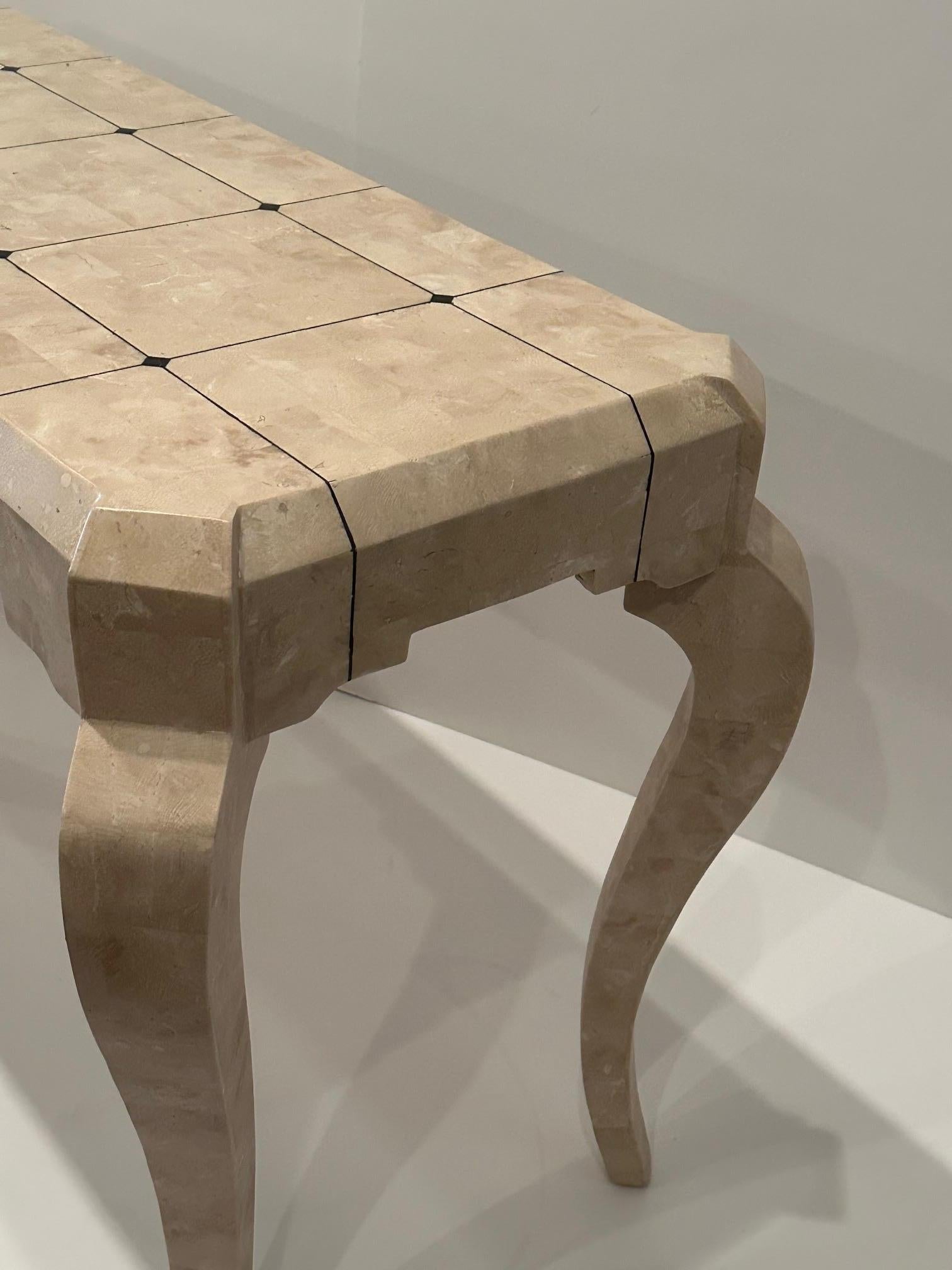 Chic modern creamy beige tessellated stone console table with contrasting black inlay on the top with striking cabriole legs.
Top 18” d , 21” d with legs
