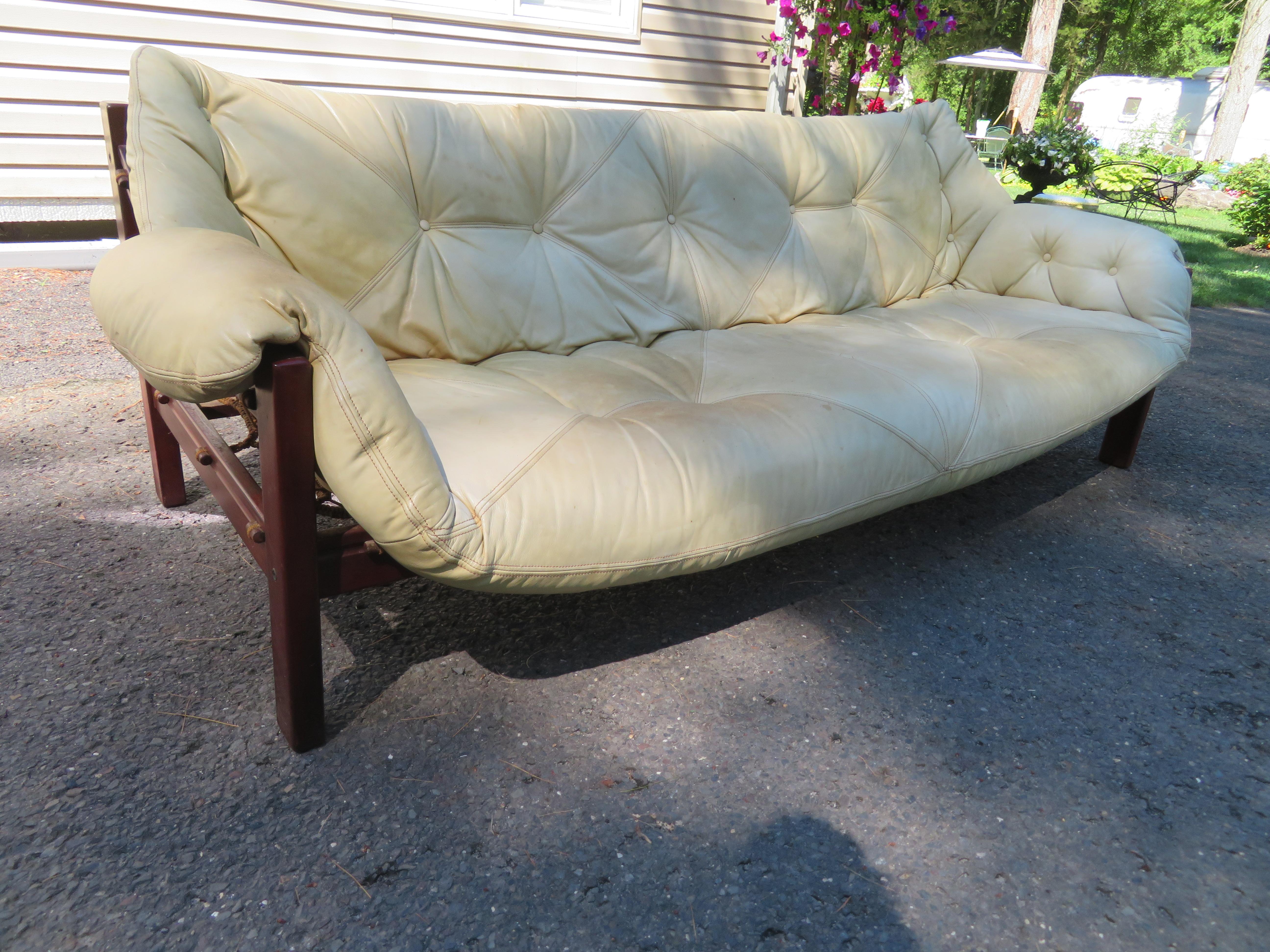 Chic vintage Jean Gillon Italma Brazilian leather and Rosewood Amazonas sofa.  This sofa measures 85