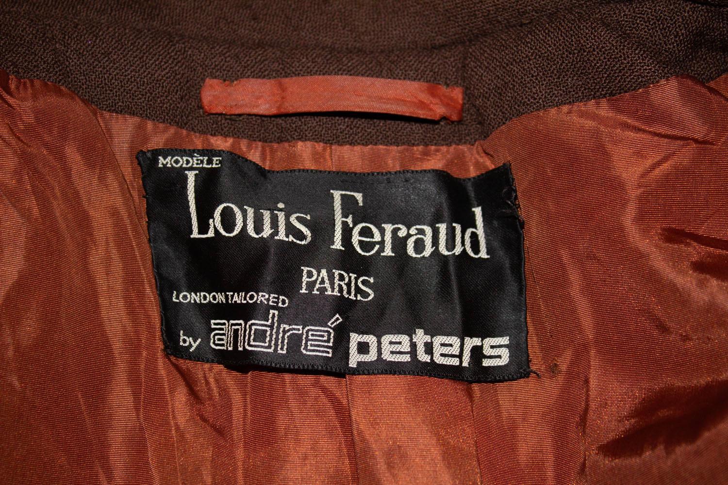 A stylish and practical vibtage coat by Louis Feraud. The coat has wonderful tailoring, and is double breasted with faux pockets and epaulettes. It is fully lined with a 20 ' vent  at the back. Measurements Bust 36
