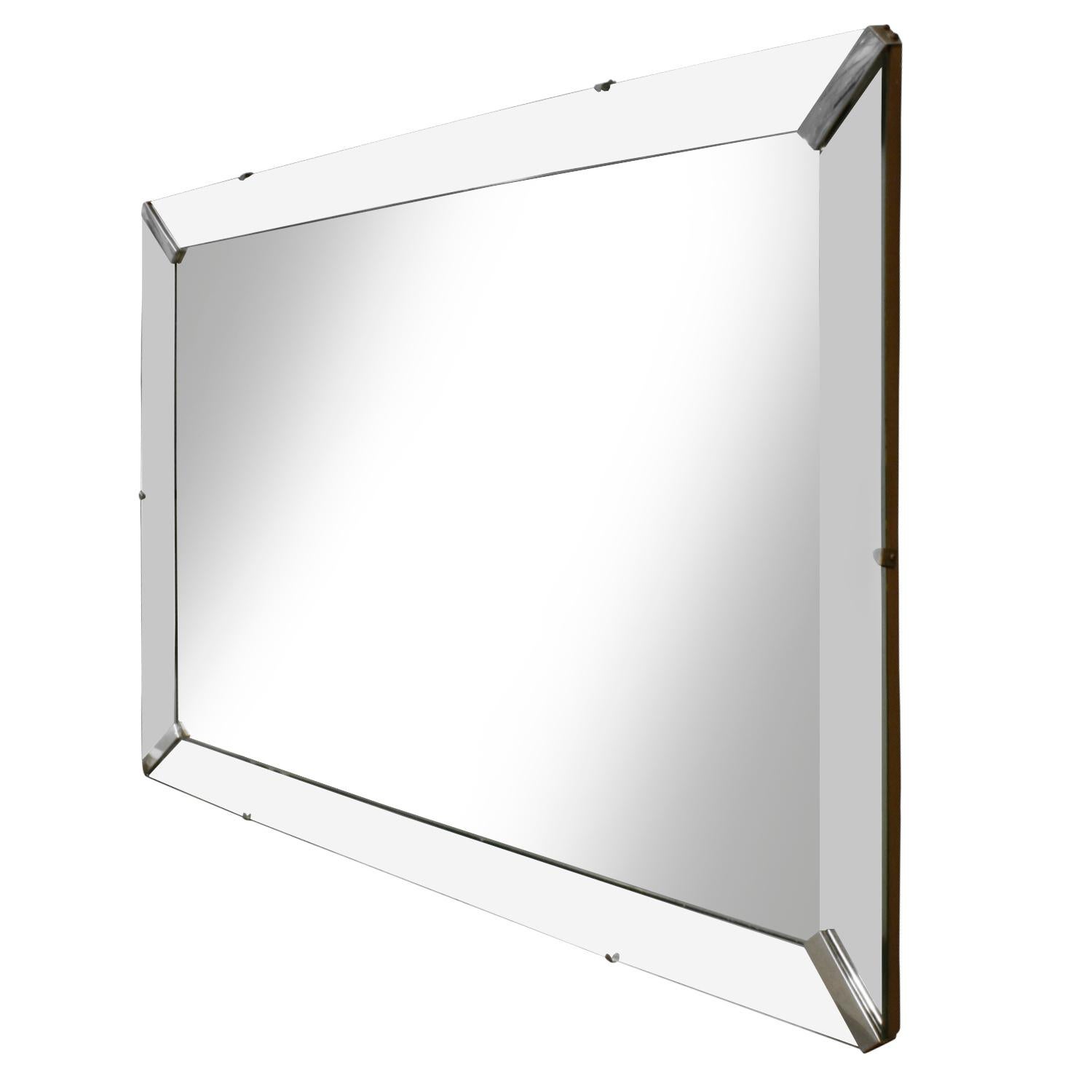 Wall hanging mirror, rectangular with chrome accents in corners, American, 1940s.