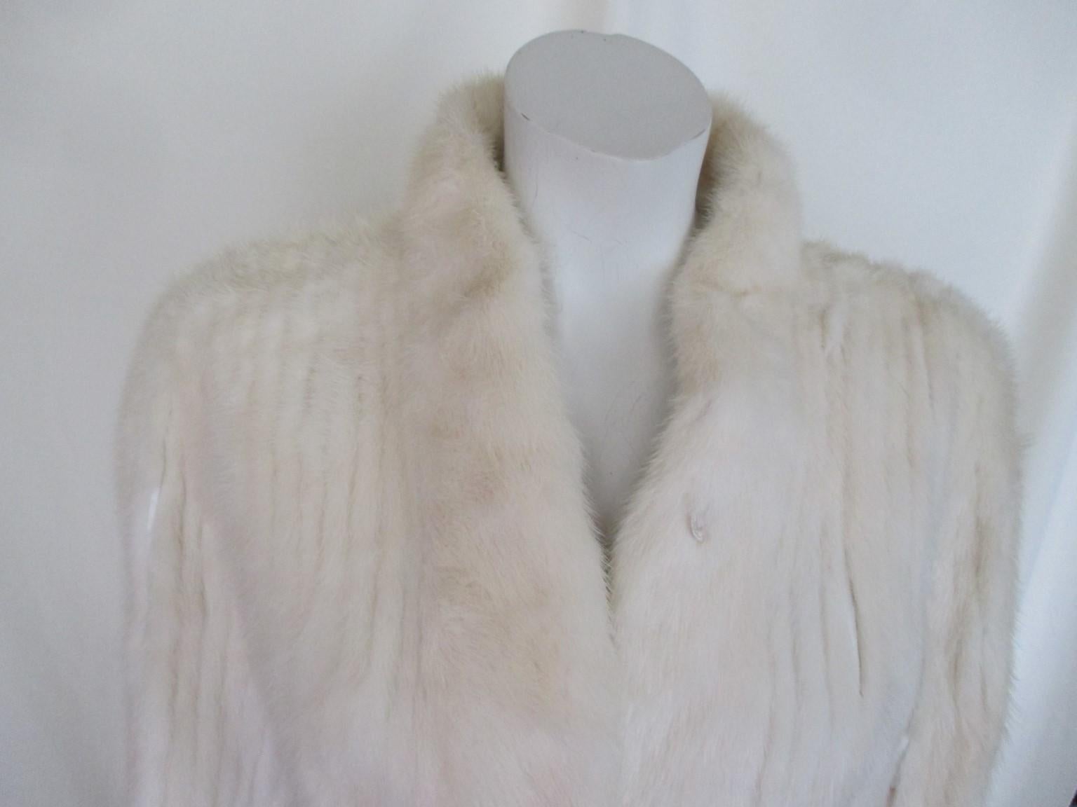 This exclusive mink fur jacket in Fendi style, is made by Hopper furs, st Louis USA 

We offer more exclusive fur and vintage items, view our frontstore

Details:
Color:  crème/white is rare to find
With 2 velvet pockets and 3 closing hooks 
Fully