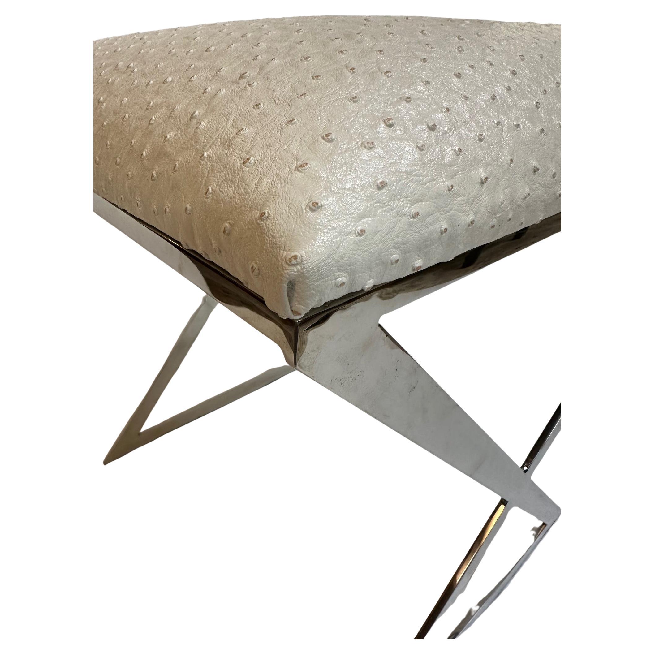 Glam vanity bench or stool having elegant polished nickel base and creamy faux ostrich upholstered seat.  Like new.