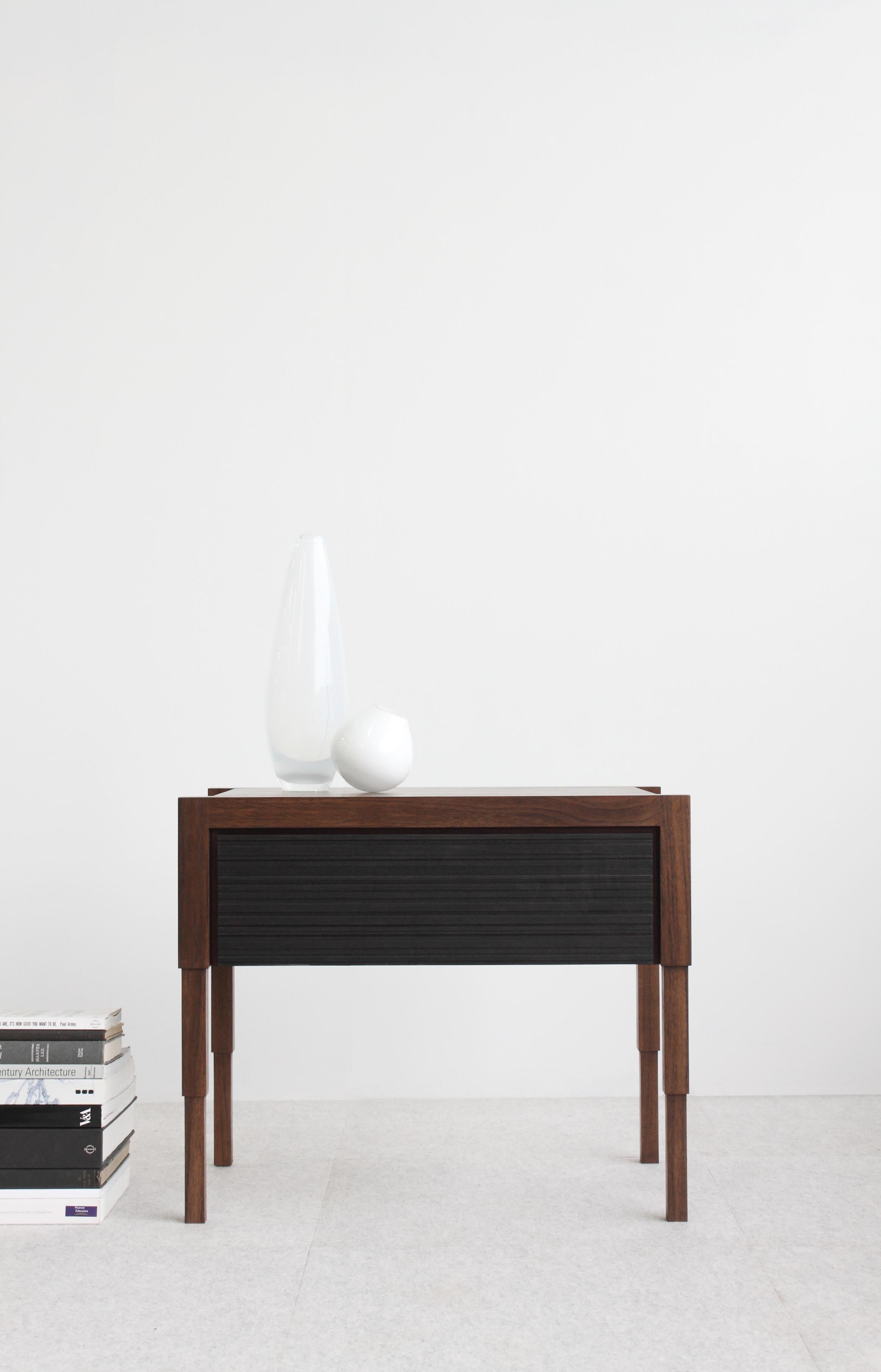 Careful consideration to detail is the acme to the design of this architecturally inspired side table or nightstand. Each table is fabricated by hand and available to order in 8 solid or combination traditional wood finish options.  
Design features