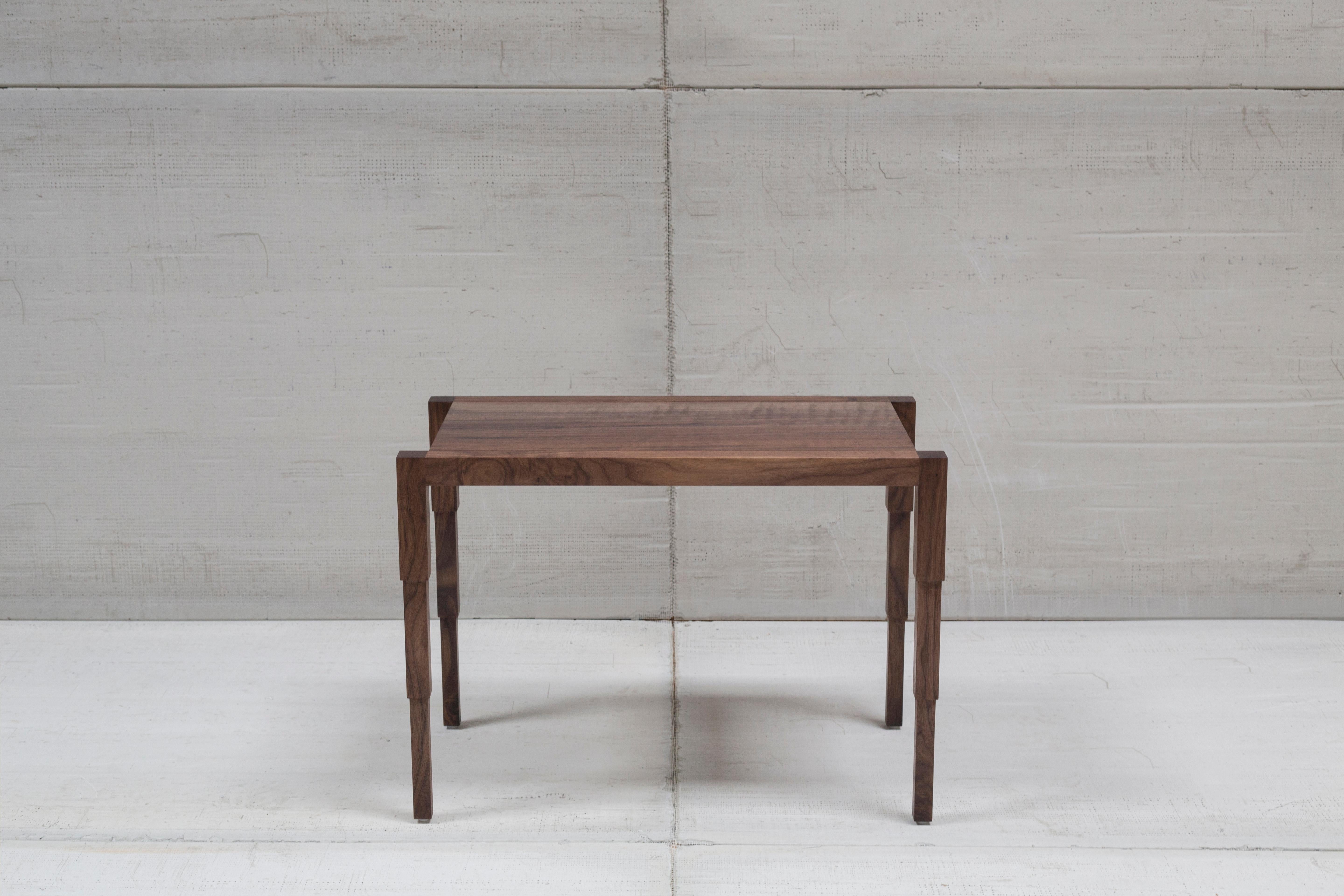 This architecturally inspired side table is anything but a side item. 
Handmade to order and custom sizes, this side table features refined lines and meticulously cut telescopic inspired legs. 

 
Standard size: 24