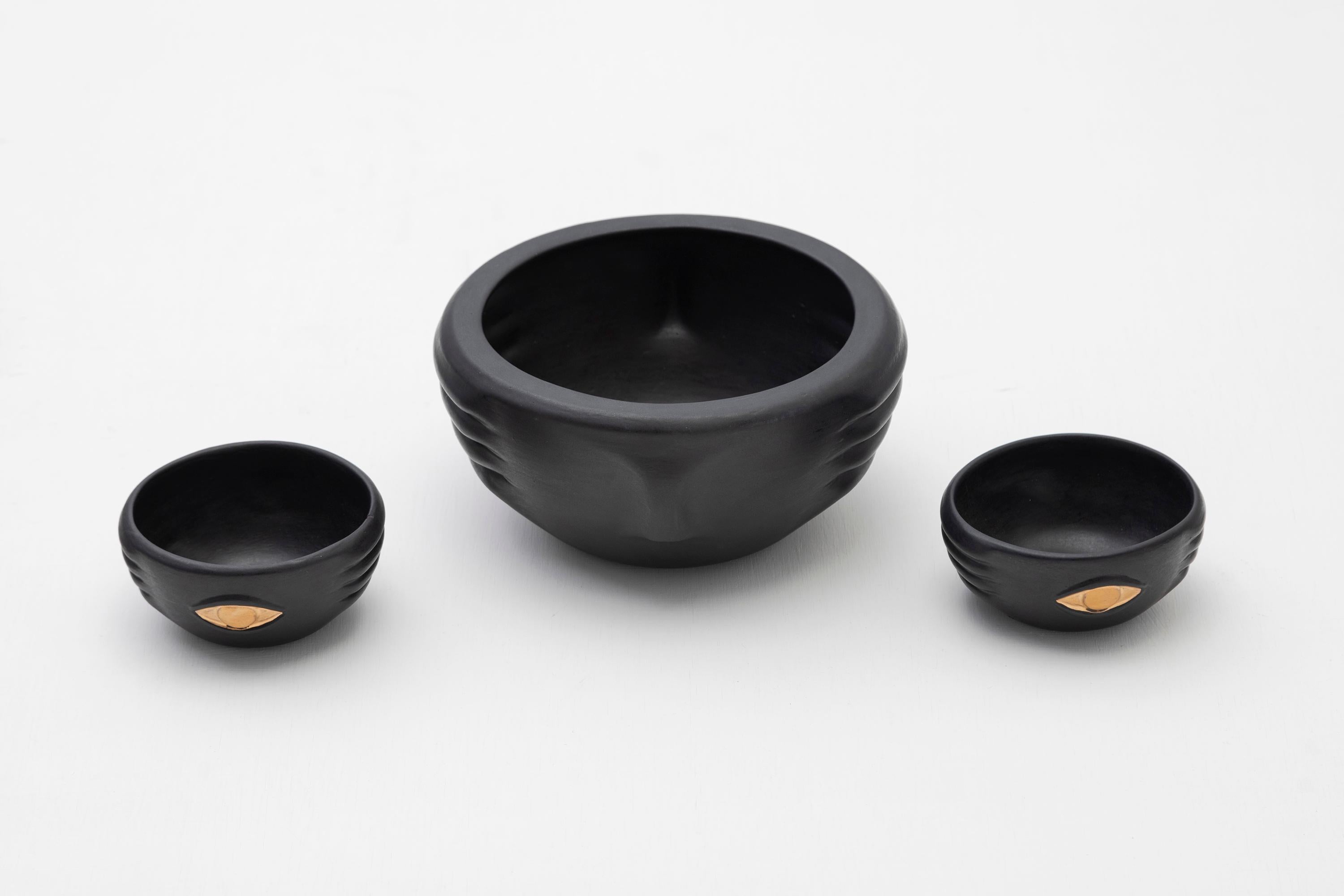 Decorative slip casted ceramic bowls finished with a rich black or dark green glaze, highlighted with gold luster details.

The Cosanga culture (1600 BC - 1532 AD) sustained its agriculture through terraces for cultivating sweet potatoes, yucca, and