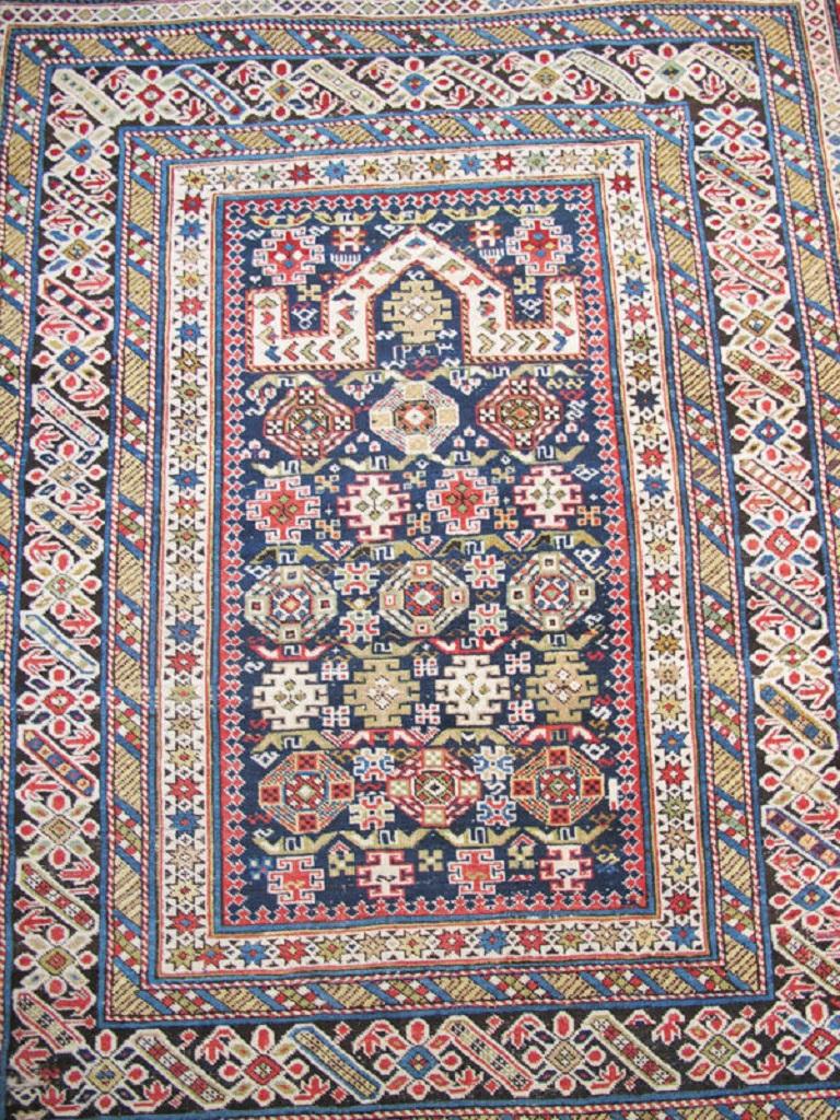 Antique Caucasian Chichi Rug, Late 19th Century

Chichi rugs from the Caucasus may be identified by their distinct main border of rosettes and diagonally oriented cartouches linked together in a repeat, often against a dark brown ground. This