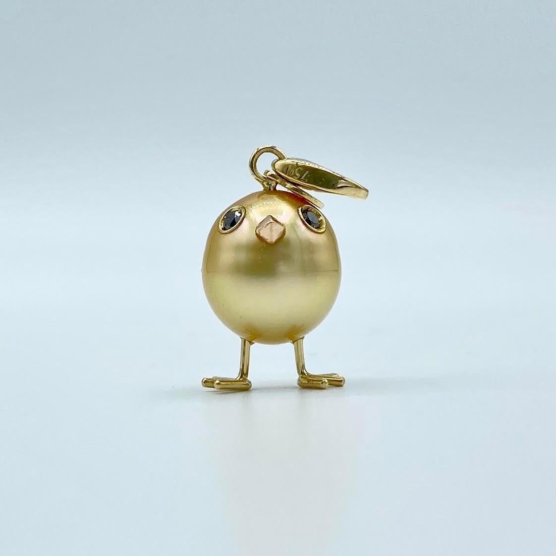 Chick Gold Pearl White Diamond 18Kt Gold Pendant Necklace or Charm 
A beautiful yellow Australian pearl has been carefully crafted to make a chick. He has his two legs, two eyes encrusted with two black diamonds and his beak. The ring for the