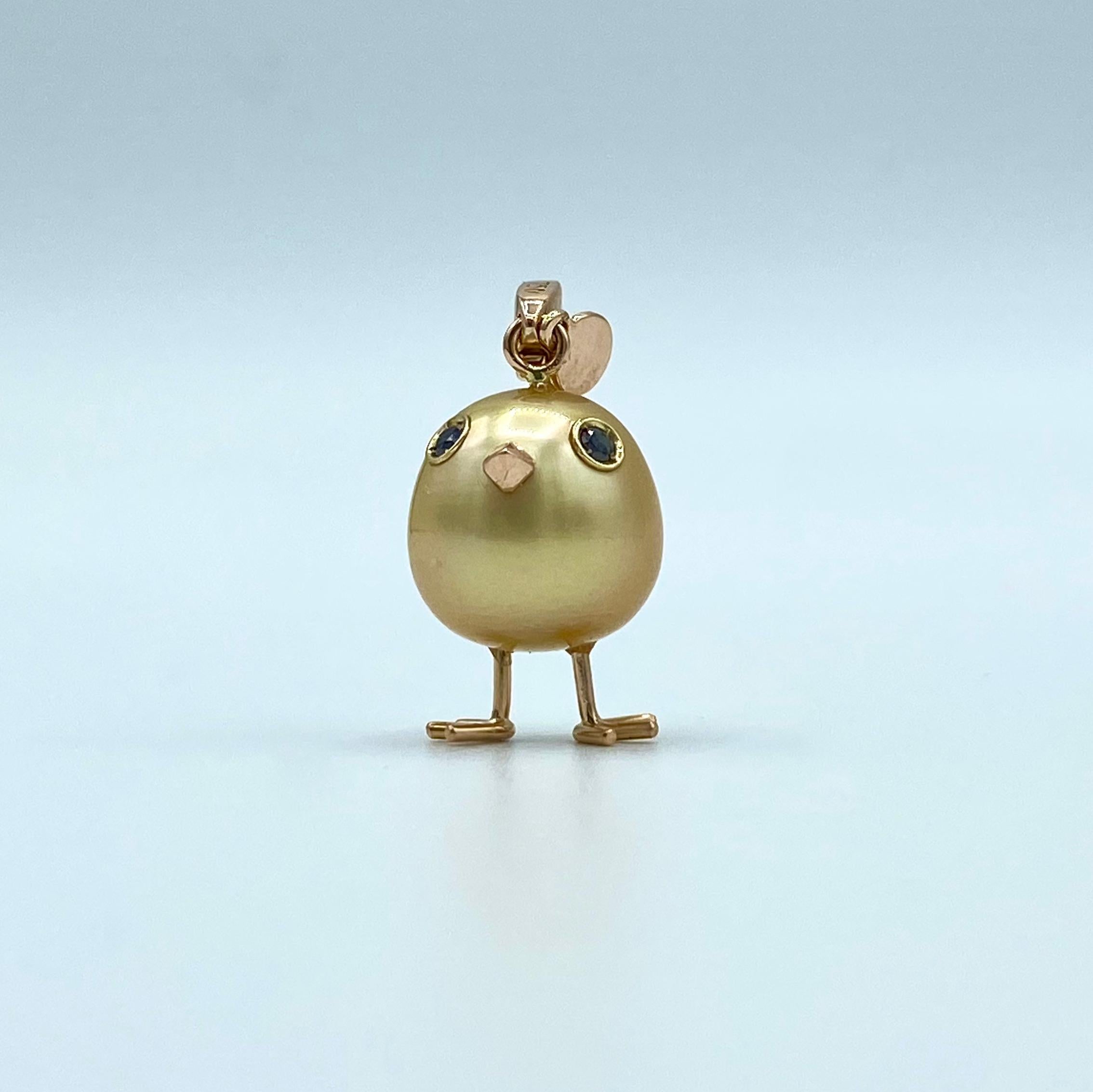 Chick Gold Pearl White Diamond 18Kt Gold Pendant Necklace or Charm 
A beautiful yellow Australian pearl has been carefully crafted to make a chick. He has his two legs, two eyes encrusted with two black diamonds and his beak. The ring for the