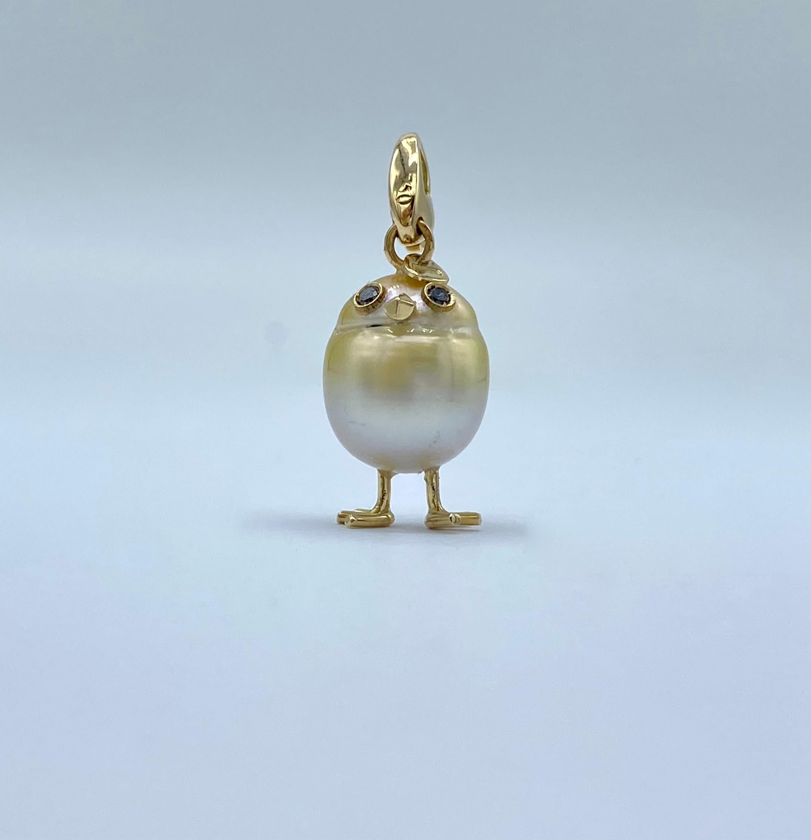 Chick Gold Pearl White Diamond 18Kt Gold Pendant Necklace or Charm 
With this gold and white Australian pearl I have carefully crafted to create a chick. He has his two legs, two eyes encrusted with two black diamonds and his beak. The ring for the