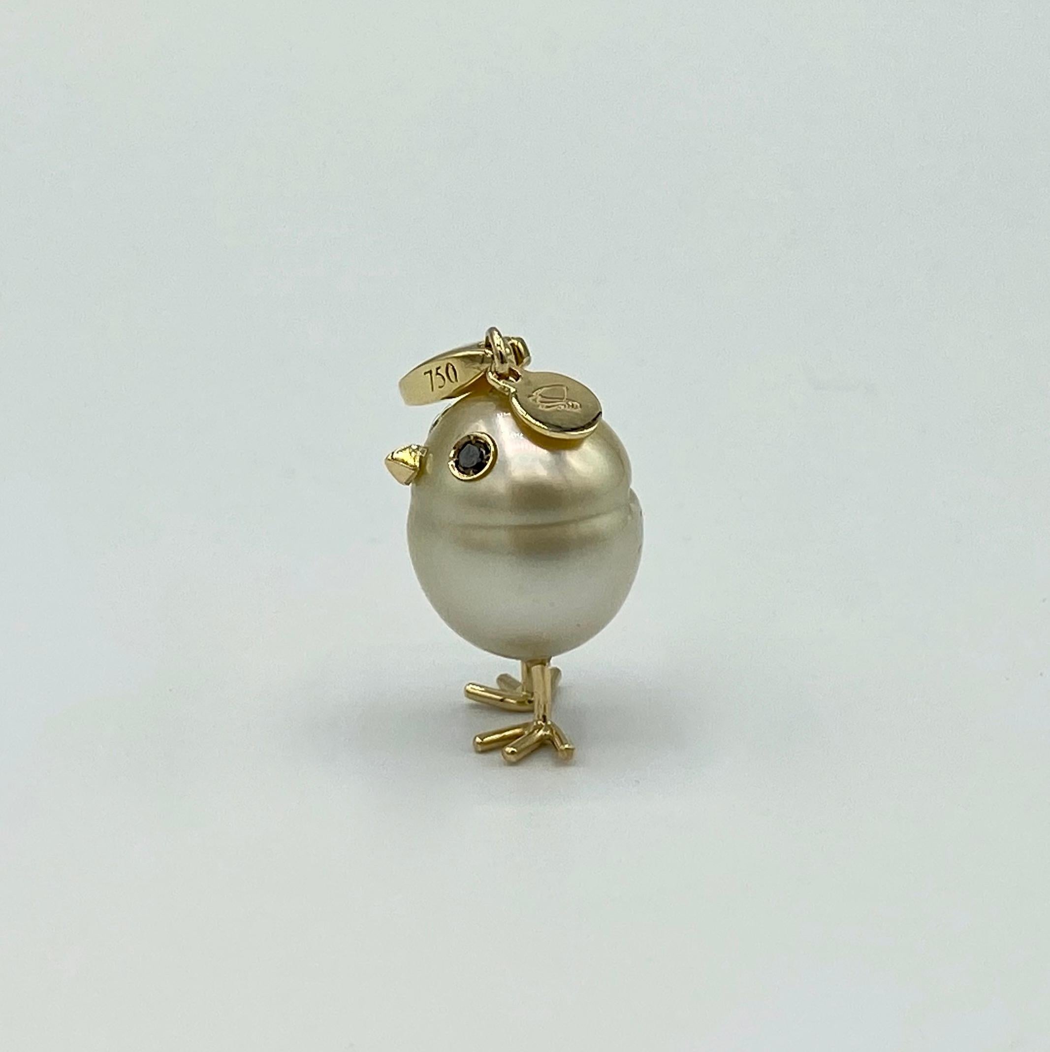 Chick Gold Pearl White Diamond 18Kt Gold Pendant Necklace or Charm 
A beautiful yellow Australian pearl has been carefully crafted to make a chick. He has his two legs, two eyes encrusted with two black diamonds and his beak. The ring for the