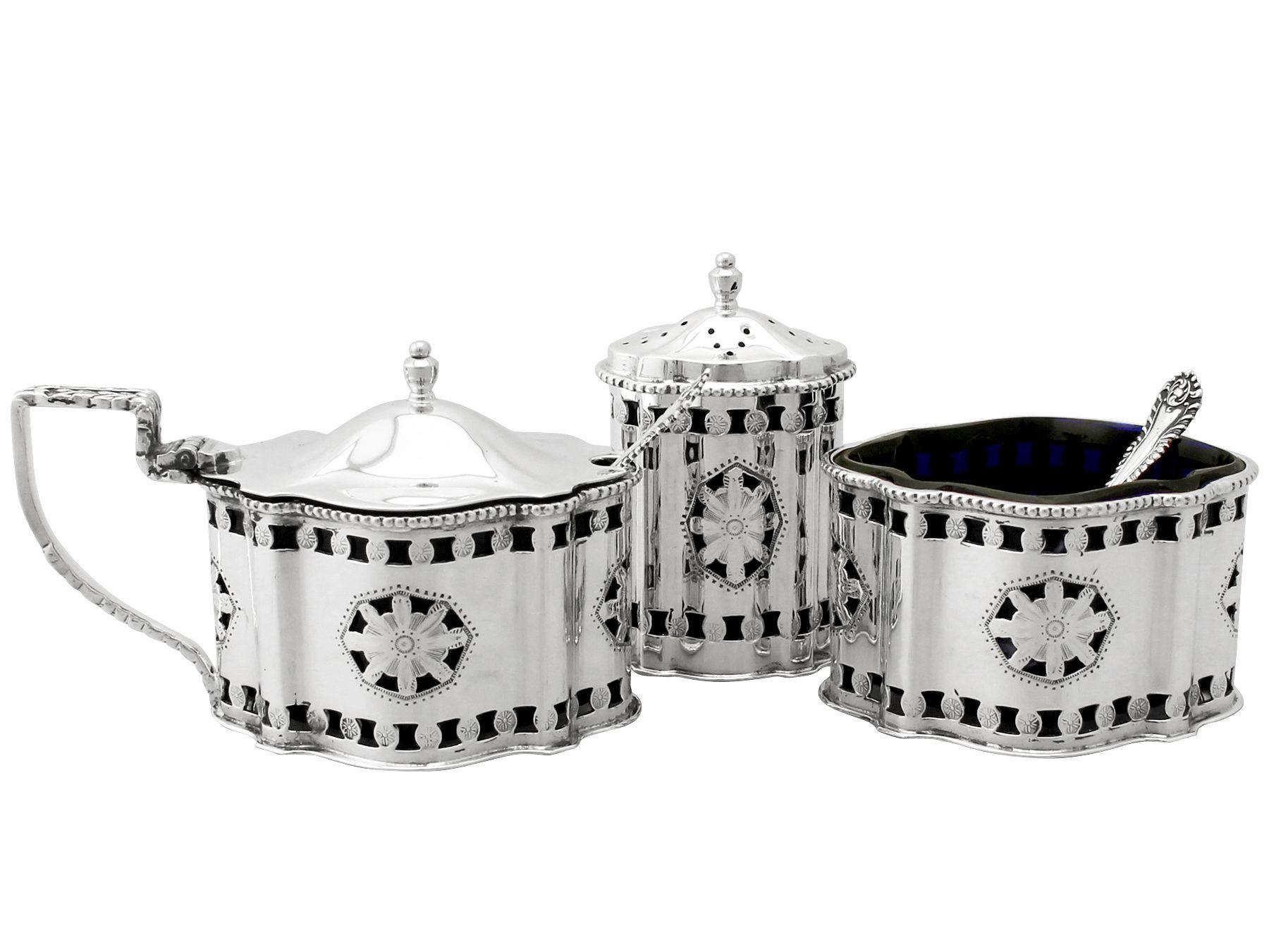 An exceptional, fine and impressive contemporary English sterling silver three-piece condiment set, boxed; an addition to our dining silverware collection.

This exceptional sterling silver three-piece condiment set consists of a salt, pepper pot